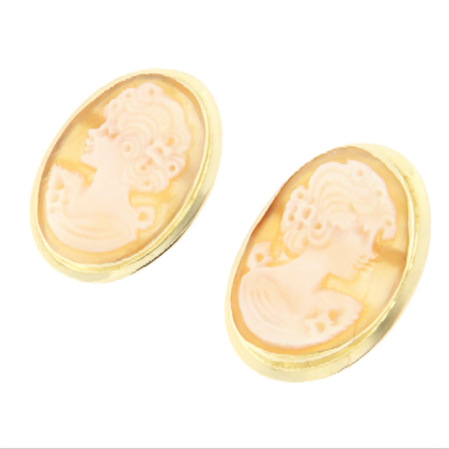 These 18-karat yellow gold earrings are a refined and sophisticated piece, crafted for those who appreciate traditional craftsmanship and the timeless charm of cameo jewelry. Each earring features a hand-carved cameo depicting an elegant female