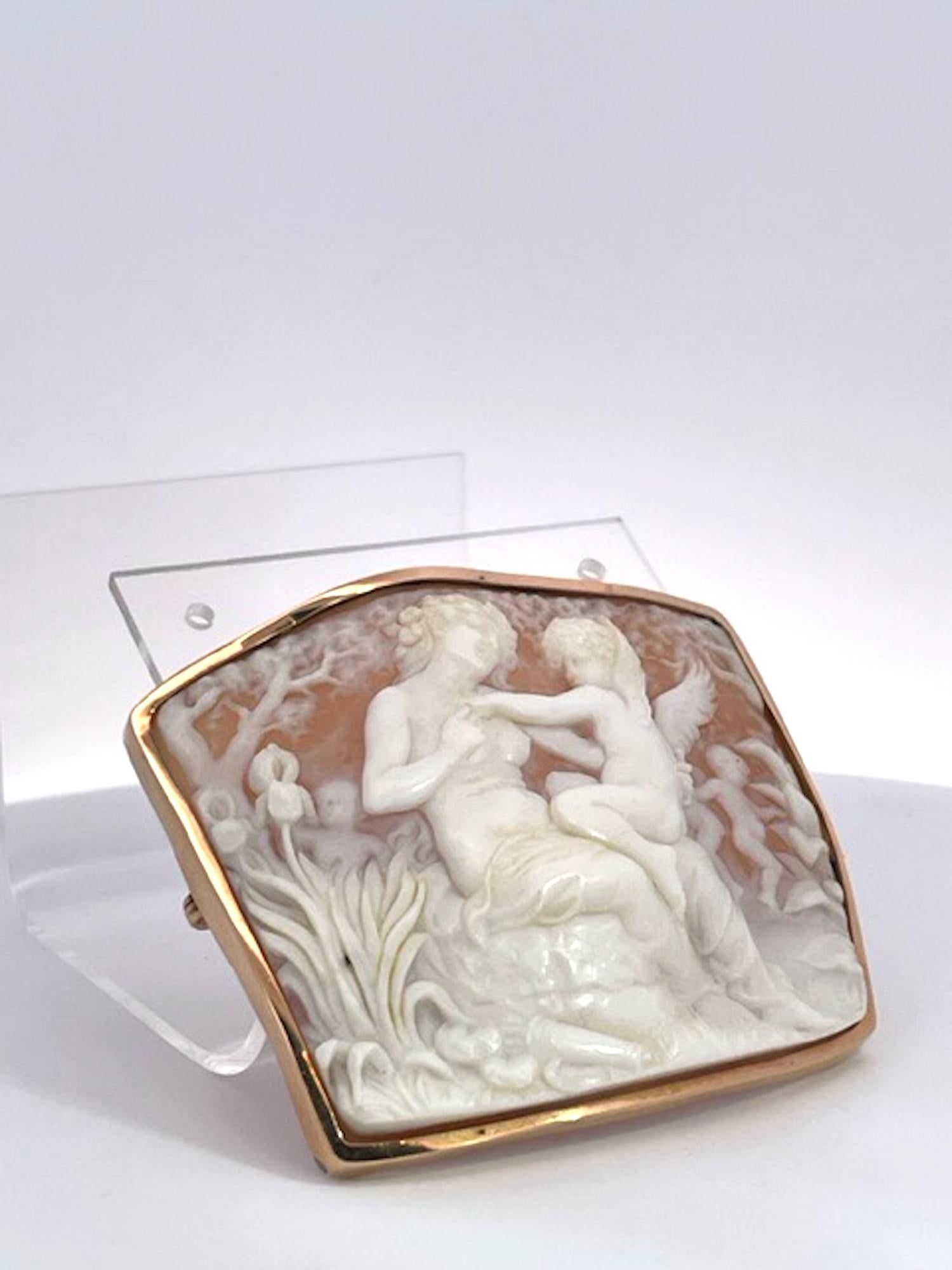 This cameo brooch is exquisite it truly is an older version than what we see today.   The carving is amazing and the Shell is really thin you can see the carvings on the reverse side.  The shell is curved as all good and older cameos are and the