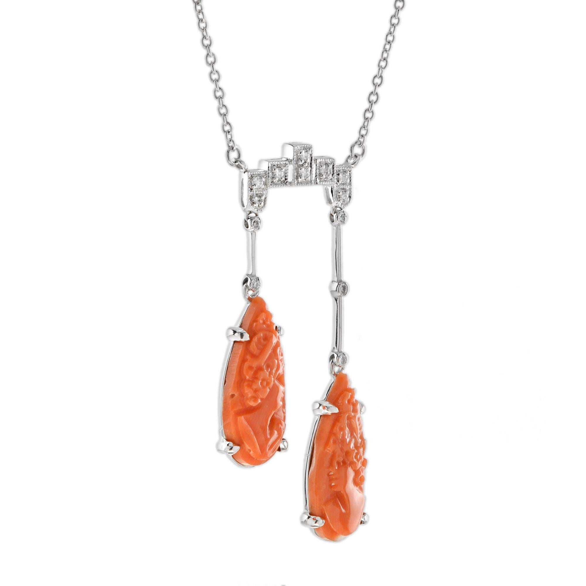An antique design negligee necklace, so delicate and elegant in its beauty. This style necklace became popular at the turn of the century. It’s features cameo carved coral  suspended from the shimmering diamonds top part necklace with different