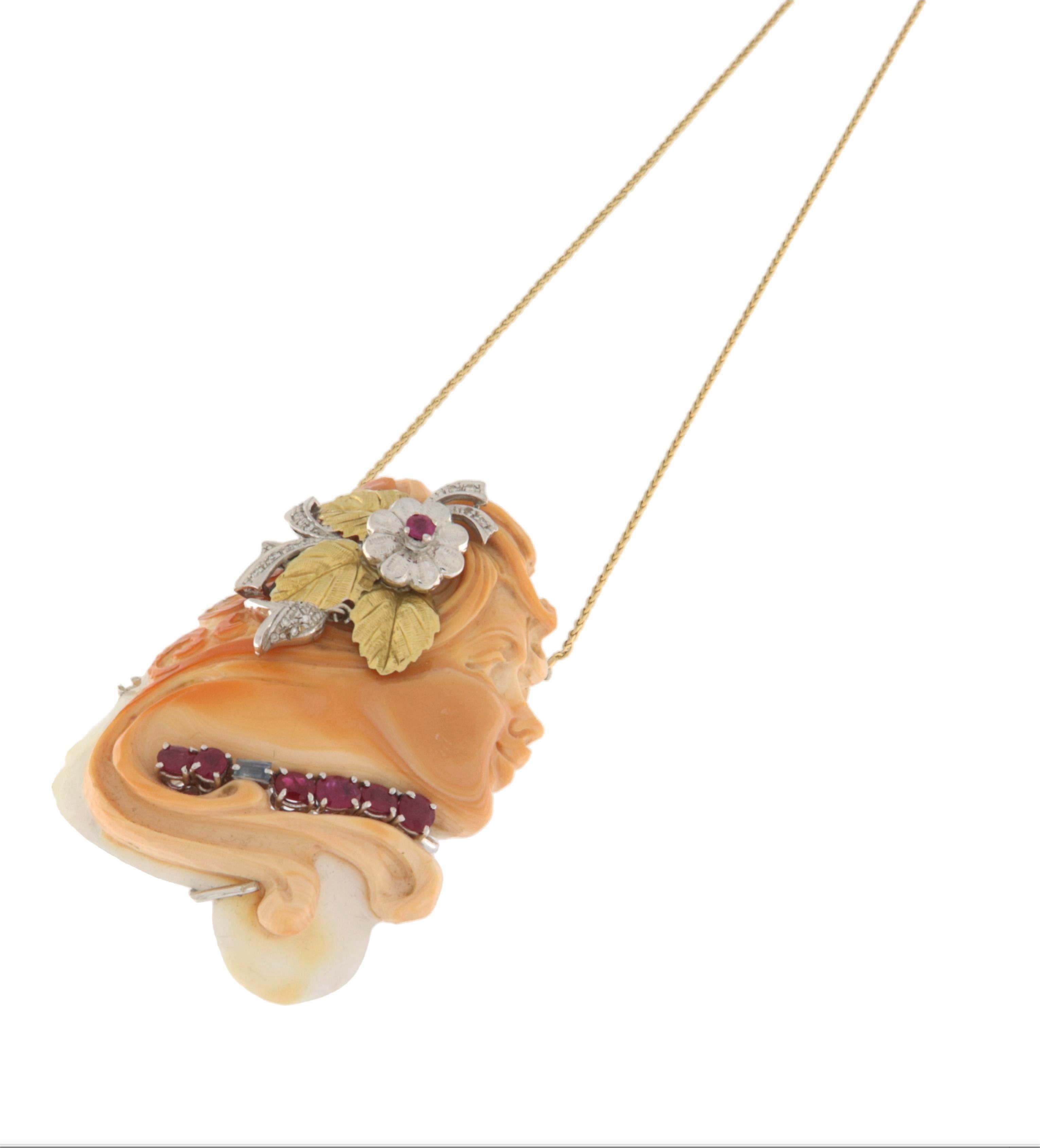A true masterpiece of fine jewelry, this coral cameo pendant embodies elegance and the exquisite craftsmanship of Italian jewelry-making. Hand-carved with precision, the cameo features a delicate female profile, adorned with ornamental details that