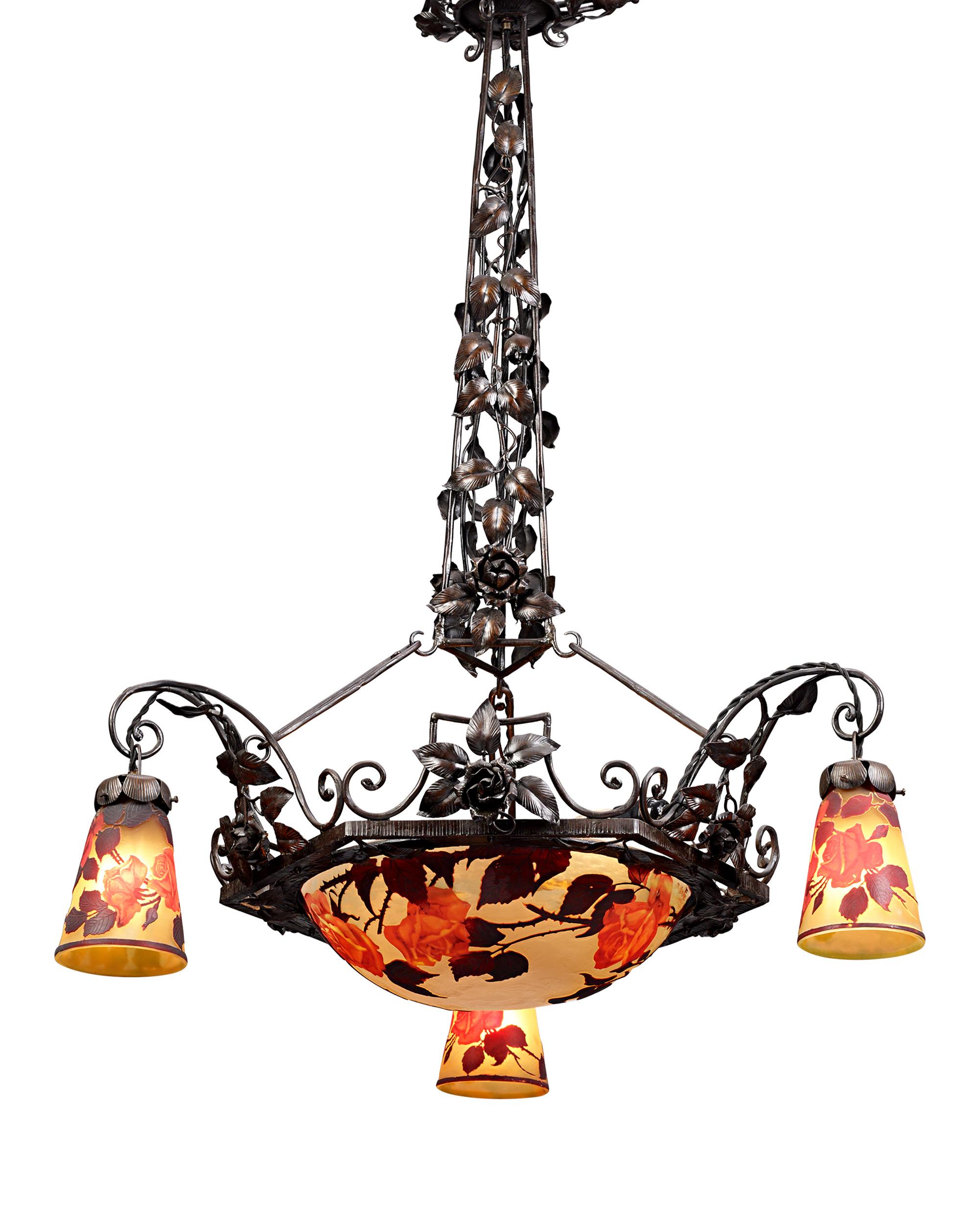 This captivating Art Nouveau chandelier by Muller Frères embodies the pinnacle of French decorative arts during this illustrious period. Muller Frères, renowned for their mastery in glassmaking, created this four-light chandelier with exquisite
