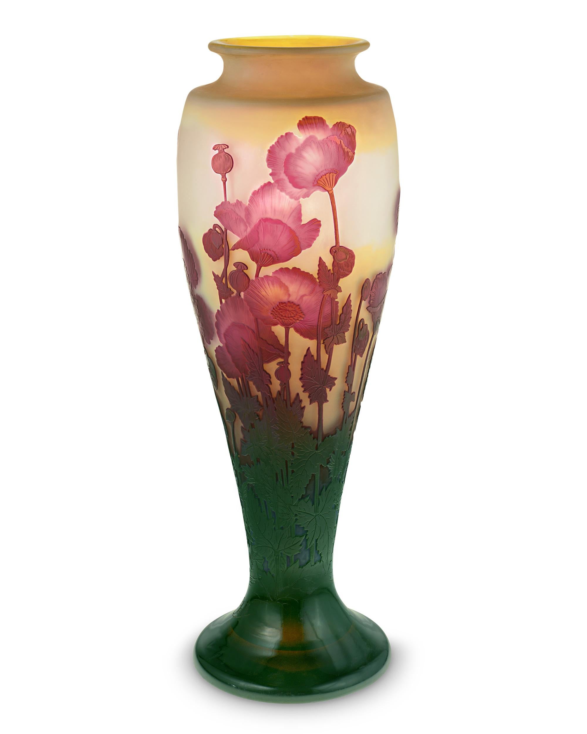Exceptional in both size and artistry, this cameo art glass vase is the work of the famed Art Nouveau master Émile Gallé, one of the most highly regarded names in French glassmaking. The artist's love of nature is evident in the detailed rendition