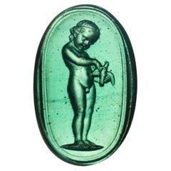 Cameo or intaglio, Child with bird. Glass. Possibly Italy, 19th century.