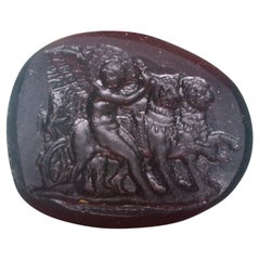 Antique Cameo or intaglio, Cupid guiding lions. Glass. Possibly, Italy, 19th century.