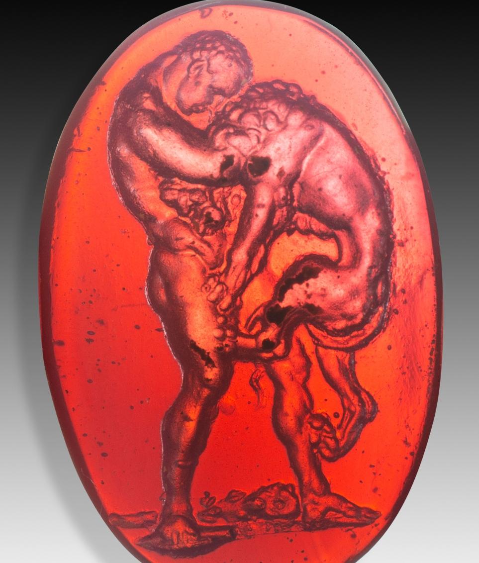  Cameo or intaglio, Hercules against the Nemean lion. Glass. Possibly, Italy, 19th century. 
The figurative representation that can be seen, of a muscular man fighting with a lion, is common in this type of neoclassical intaglios. It is considered