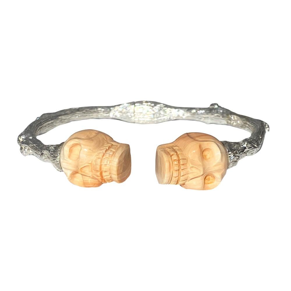 Channeling the eternal Tree of Life, the organic spirit of K. Brunini is captured through this Twig cuff in sterling silver artfully capped with carved cameo shell skulls.

In the Twig Collection, nature exists alongside elegant luxuries, but the
