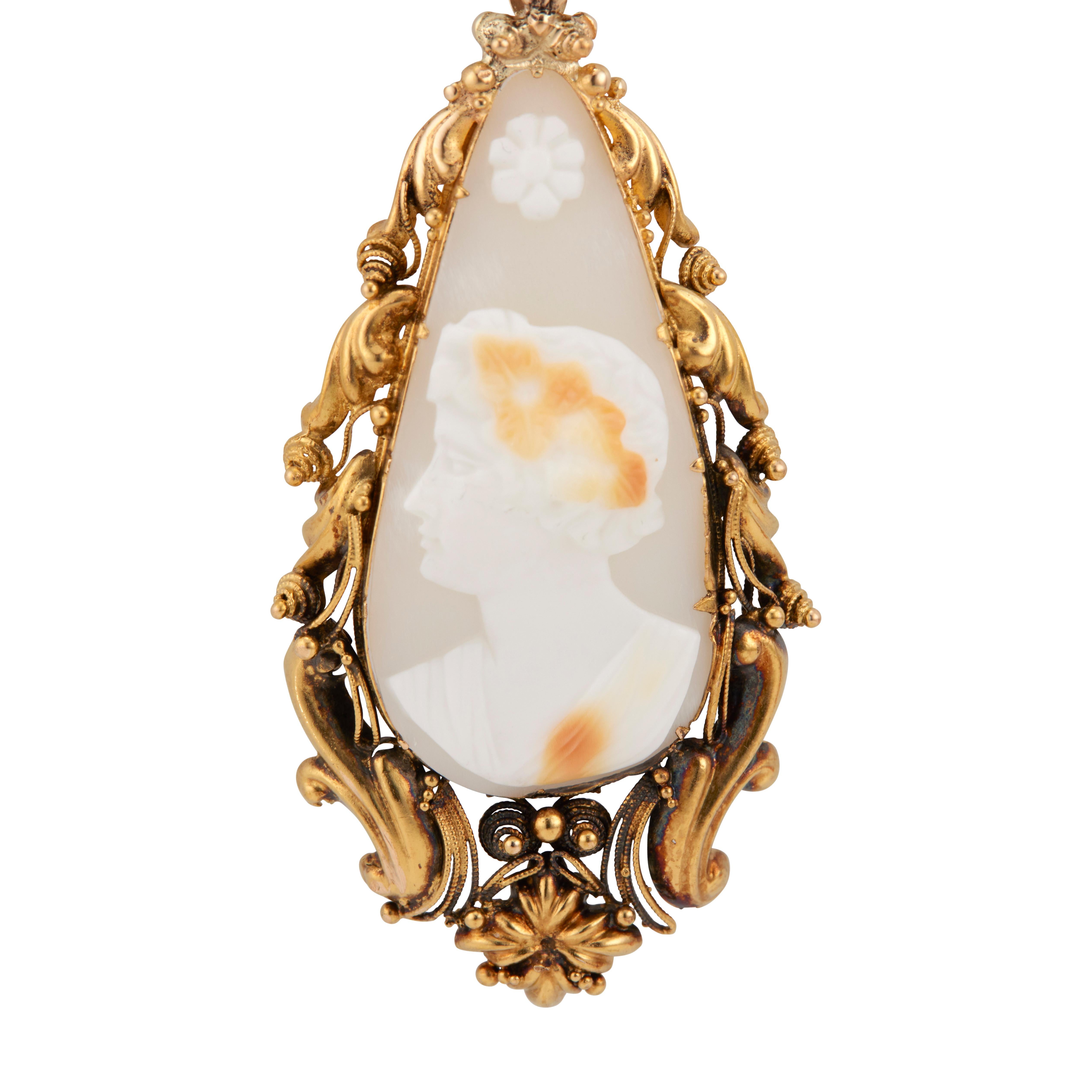 1820's Cameo pendant necklace. All original handmade pendant, circa 1820. Tear drop shaped, hand formed using chasing, repose and delicate twisted wire techniques all around the frame. The frame holds a translucent multi color shell carving of a