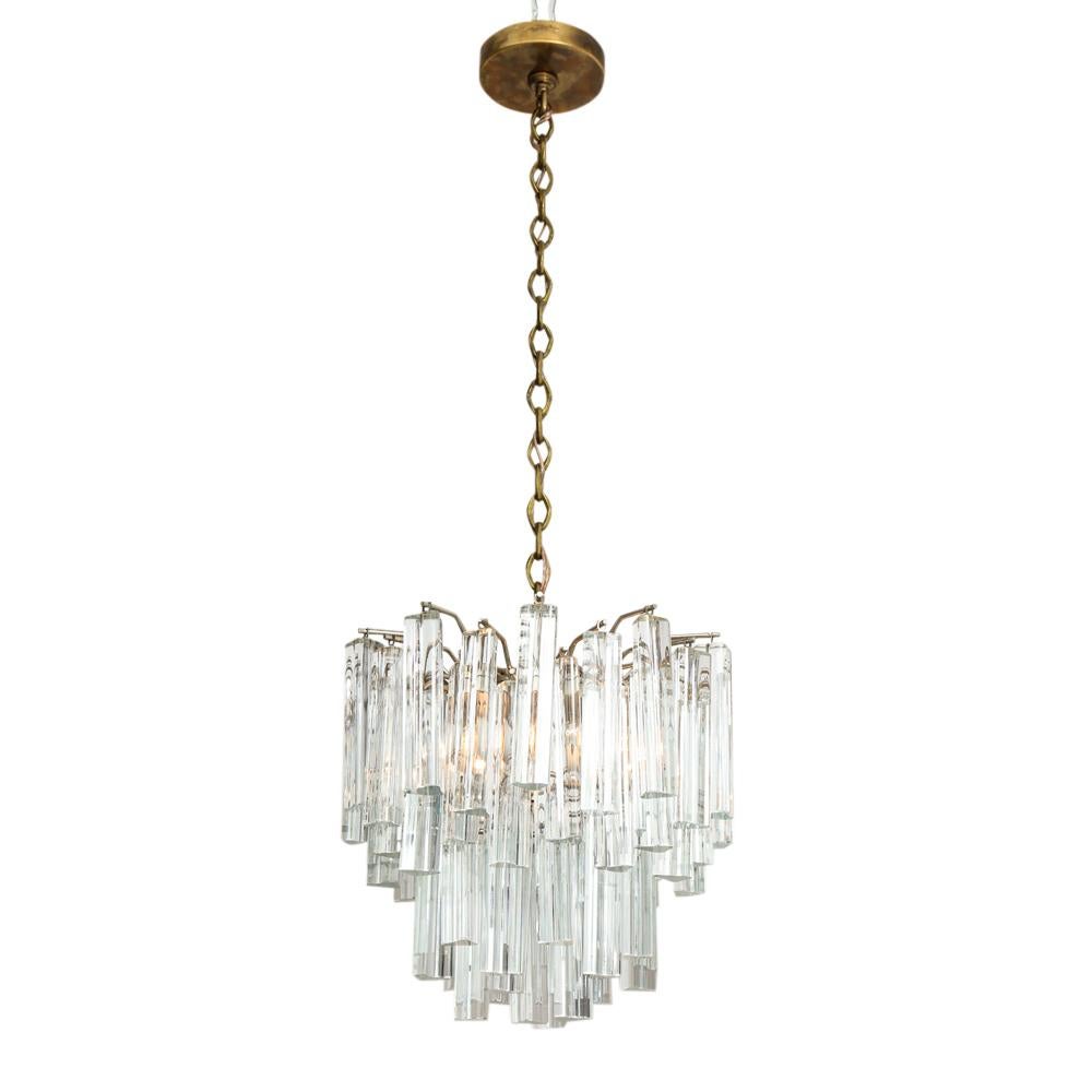 Camer chandelier, glass, Signed. 4 of the 60+ glass crystals have very minor chipping to bottom edges, otherwise in good original condition. Brushed nickel frame retains a paper label which reads: Camer Glass made in Italy. With original brass