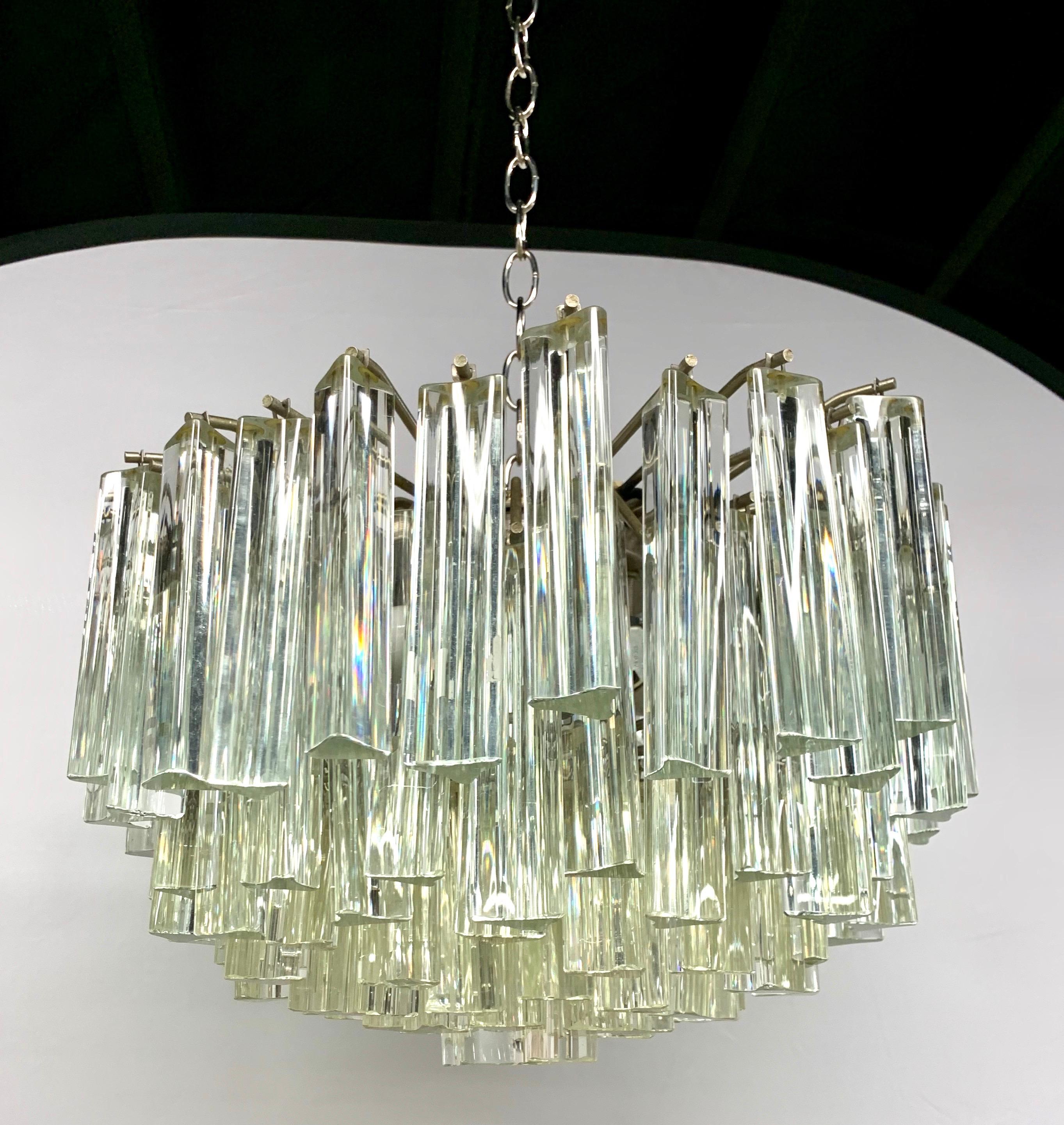 Elegant Camer glass prism Mid-Century Modern chandelier where Murano glass prisms hang individually and great a magnificent look. If you've ever opened Architectural Digest, you've certainly seen Camer
chandeliers. None better in our humble opinion