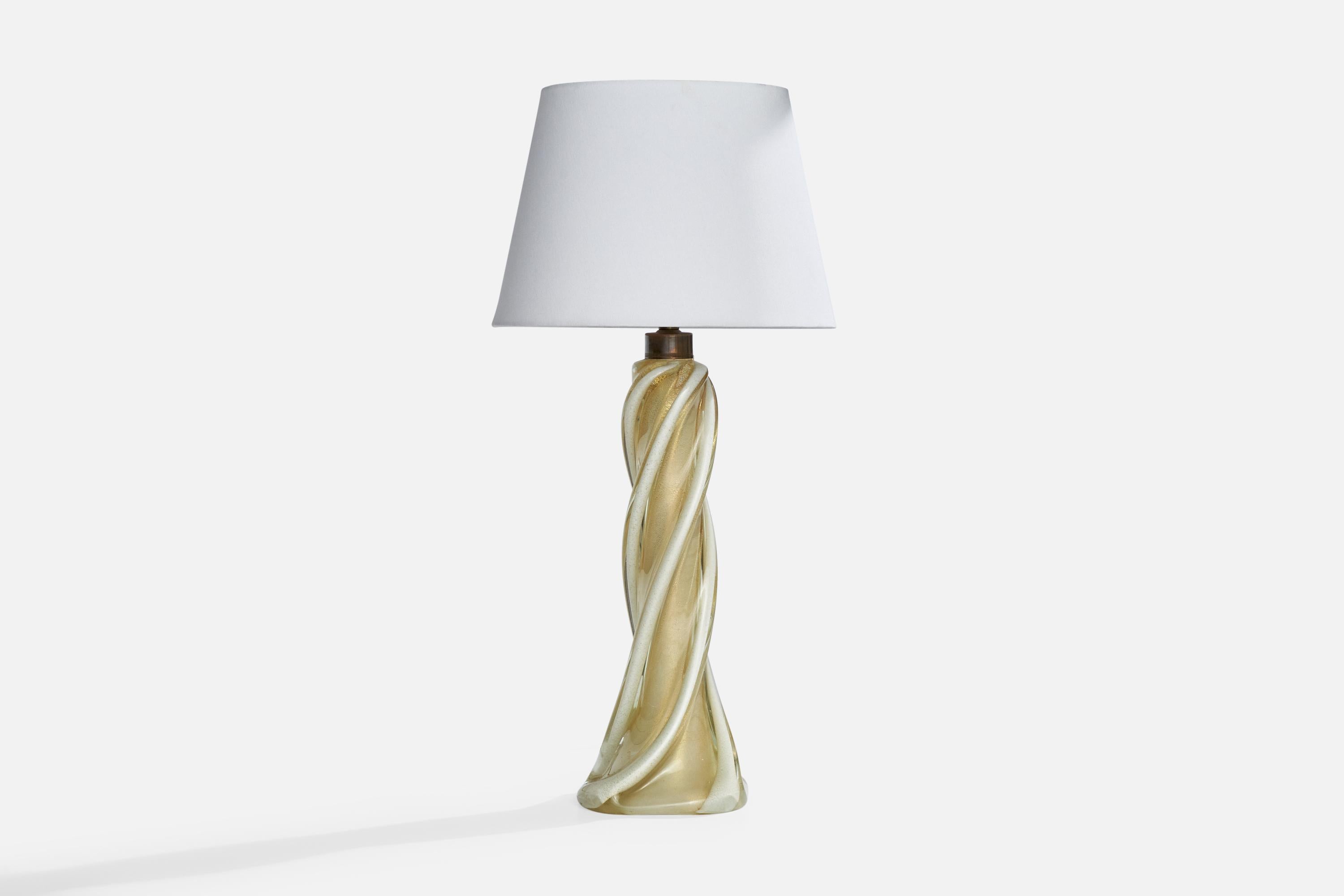 A brass and blown red-colored glass table lamp produced by Camer Glass, Italy, c. 1980s.

Dimensions of Lamp (inches): 29“ H x 7“ Diameter

Dimensions of Shade (inches): 10” Top Diameter x 14” Bottom Diameter x 10“ H

Dimensions of Lamp with Shade