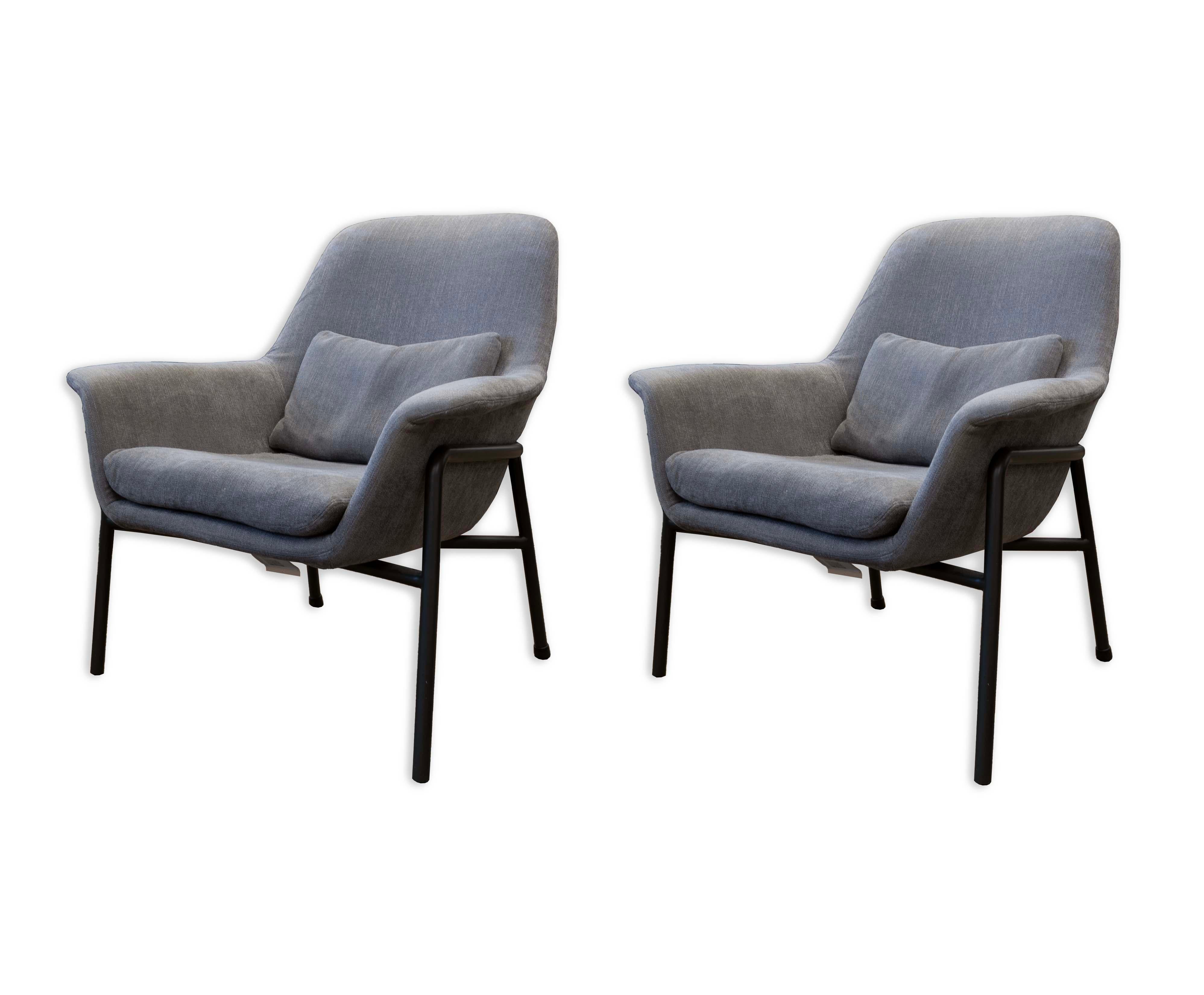 Inviting and sophisticated, these Camerich Noble Grey Lounge Armchairs embody the sleek aesthetics of Mid-Century Modern in a contemporary modern design. Upholstered in a plush noble grey fabric, each chair features a deep, welcoming seat cushion