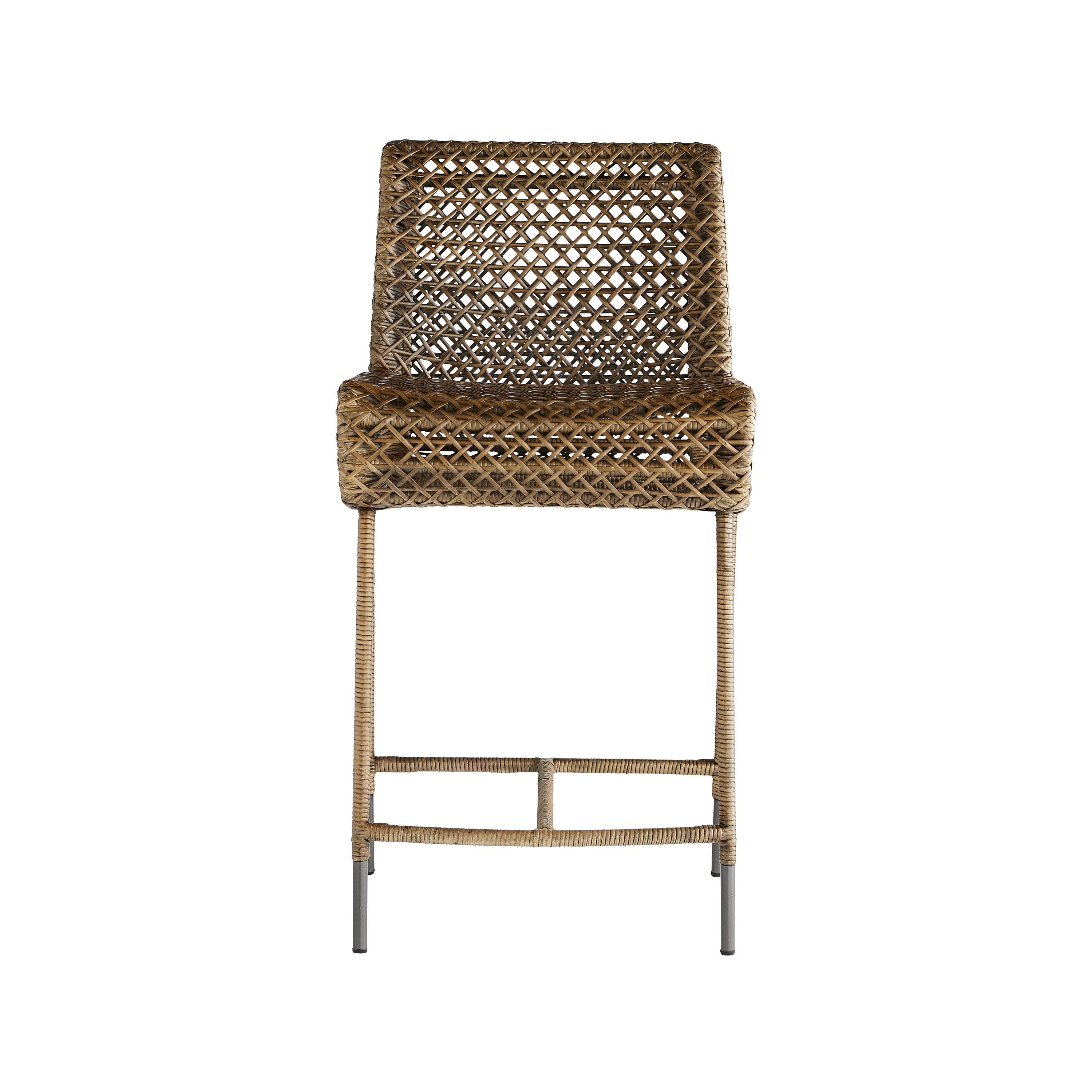 Thinly sliced pieces of rattan peel are first steamed and then bent by hand to shape this stylish seat. A chestnut wash finish and exposed feet work to further enhance its natural characteristics and the double-layer of its open-form structure adds