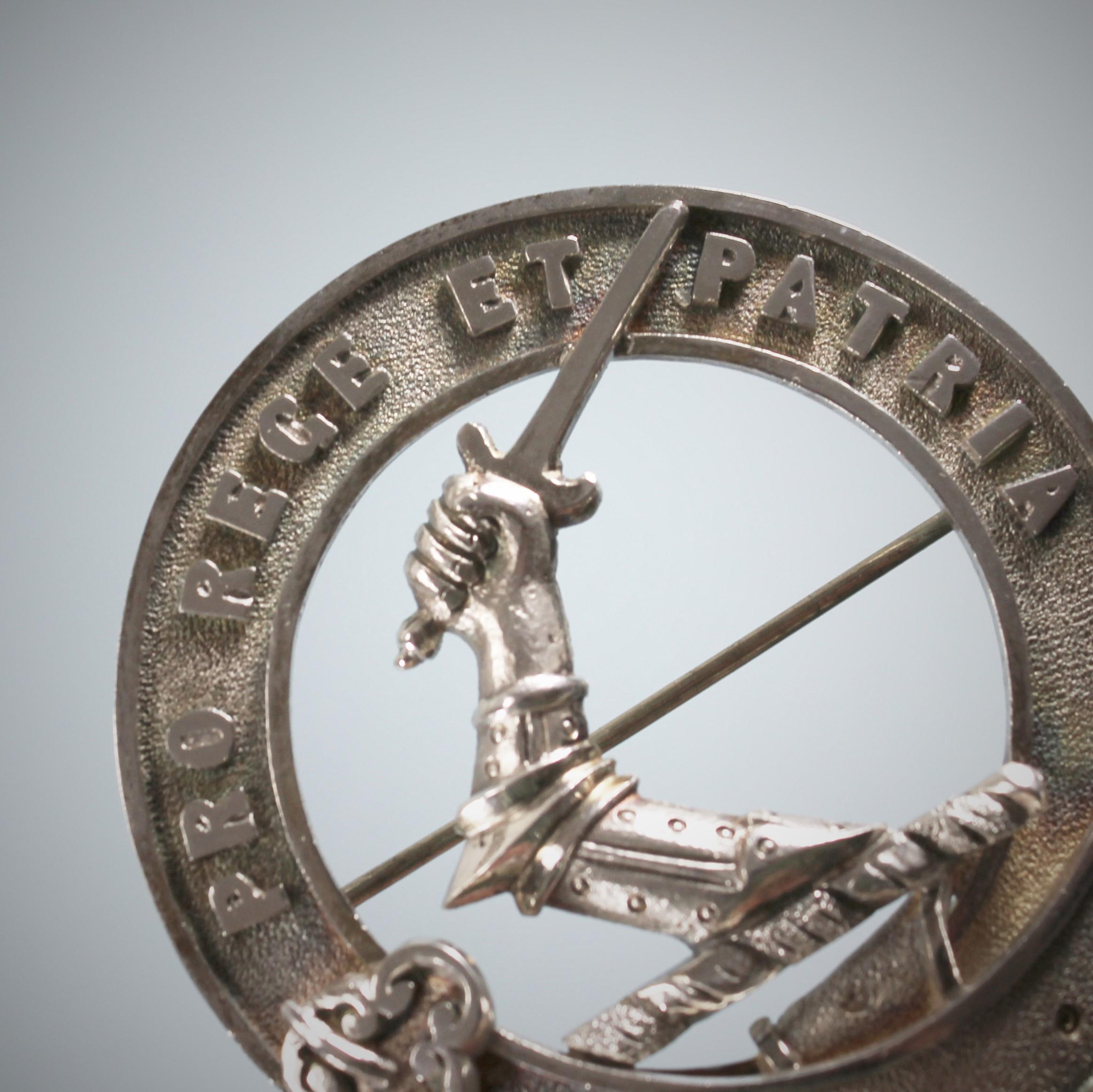 Cameron Scottish antique silver clan badge.
Scotland, circa 1880.
MOTTO: 'Pro Rege Et Patria'. 

Measures: Diameter 2.1 inches (5.33cm) 
Weight: 0.90 troy ounces (28 grams).