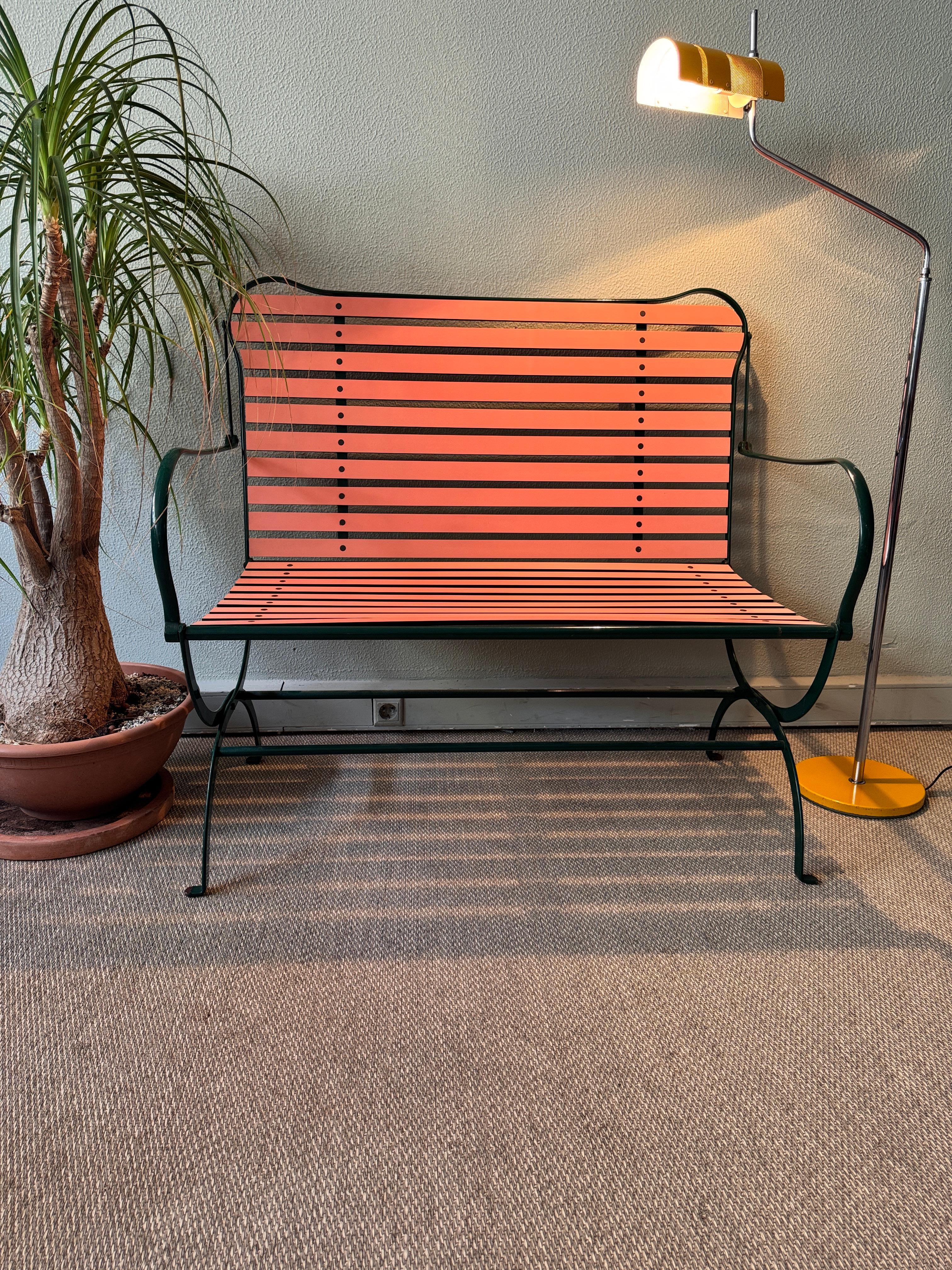 
The Camila Bench by Achille Castiglioni for Zanotta, designed in 1984, is an iconic piece of Italian postmodern design that fuses aesthetic appeal with innovative functionality. The bench features a coral-colored seat and backrest crafted from