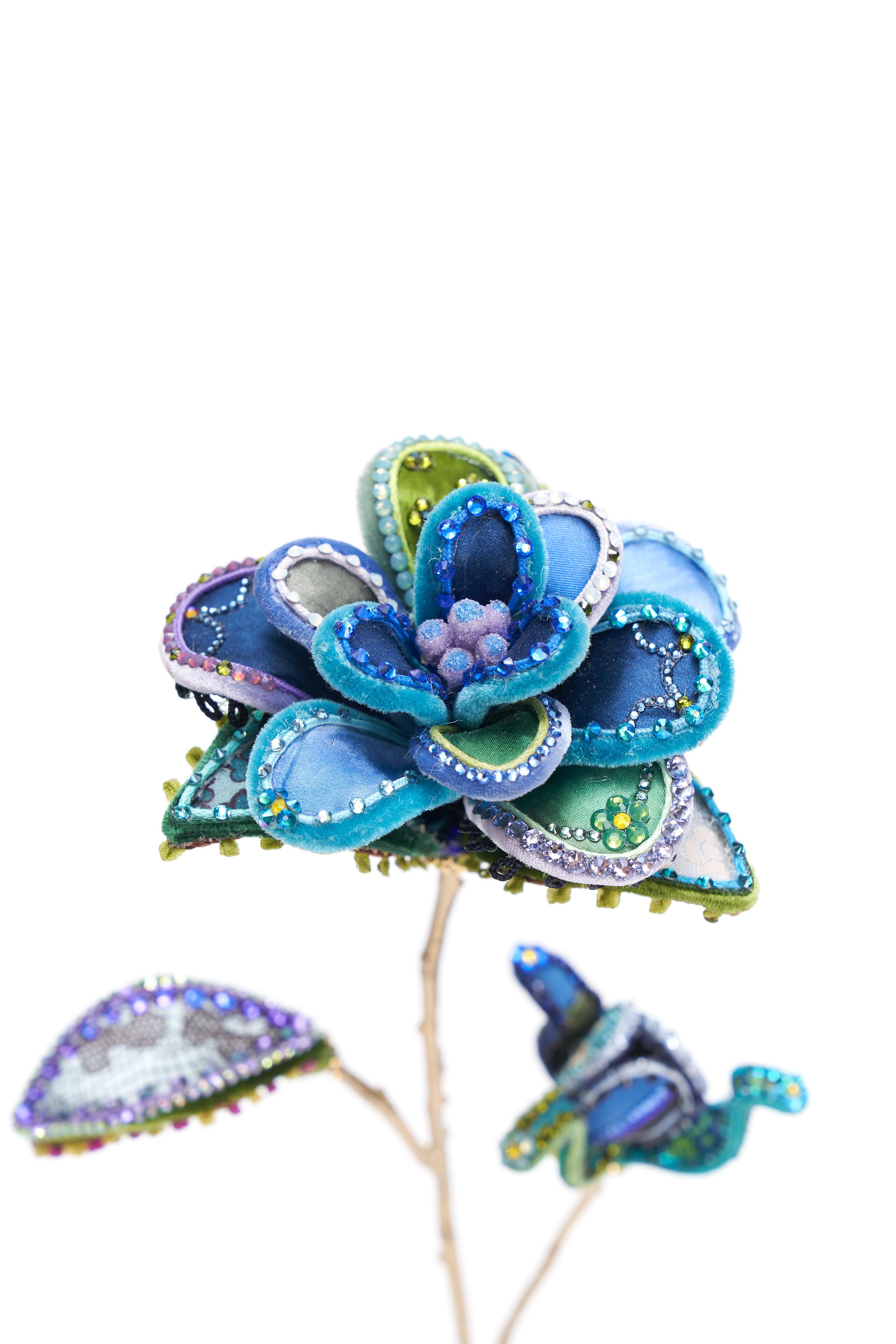 Blue Rose in silk and velvet resting upon a heart-shaped brass base. Adorned with vintage millinery embellishments. Designed and handmade in NYC. Comes in both stoned & un-stoned variations. Image featured is stoned.