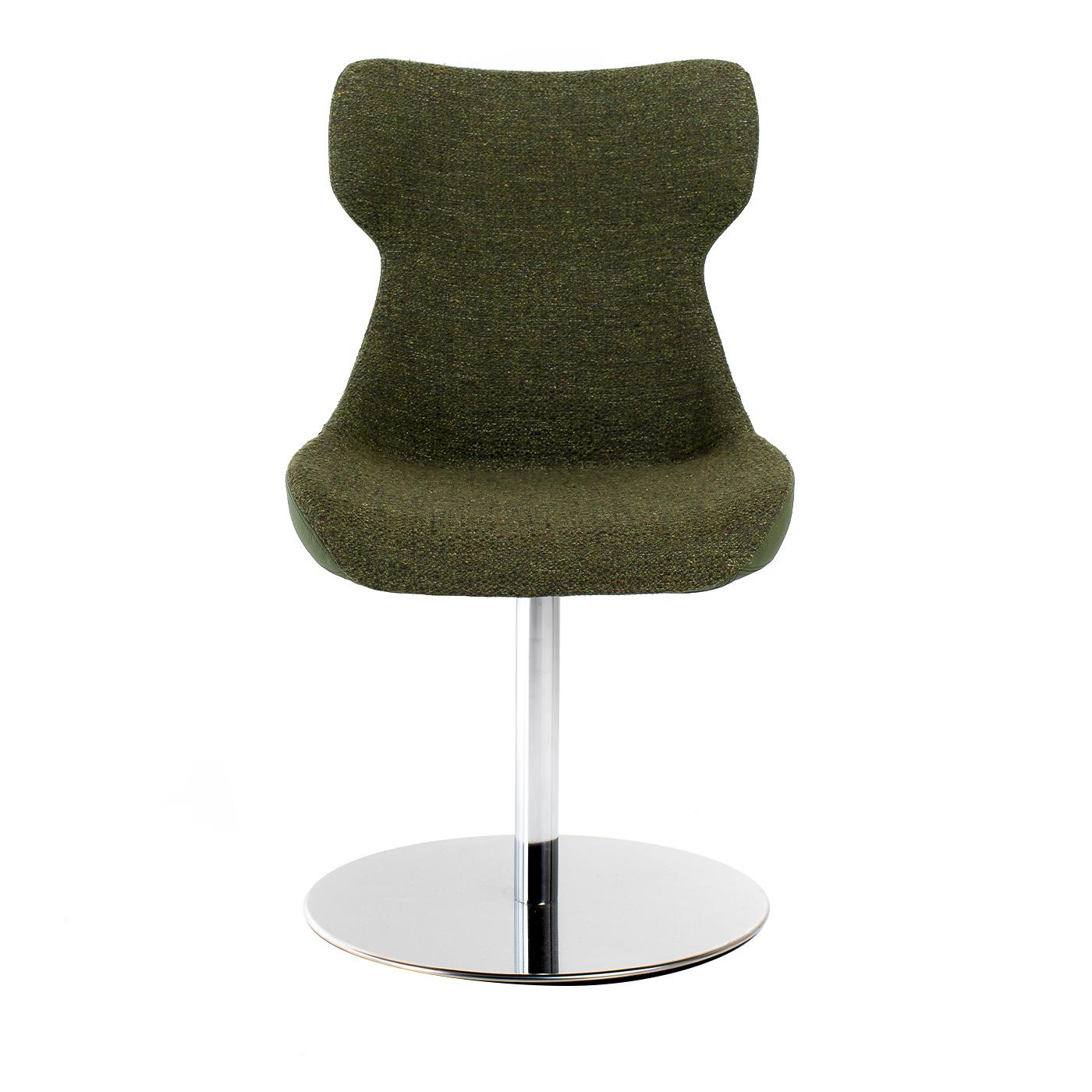 The refined design of the Camila chair makes it a perfect complement to any home or office decor. This unique piece of furniture is characterized by the juxtaposition of leather and fabric, both in a matte olive-green nuance. A silver-lacquered