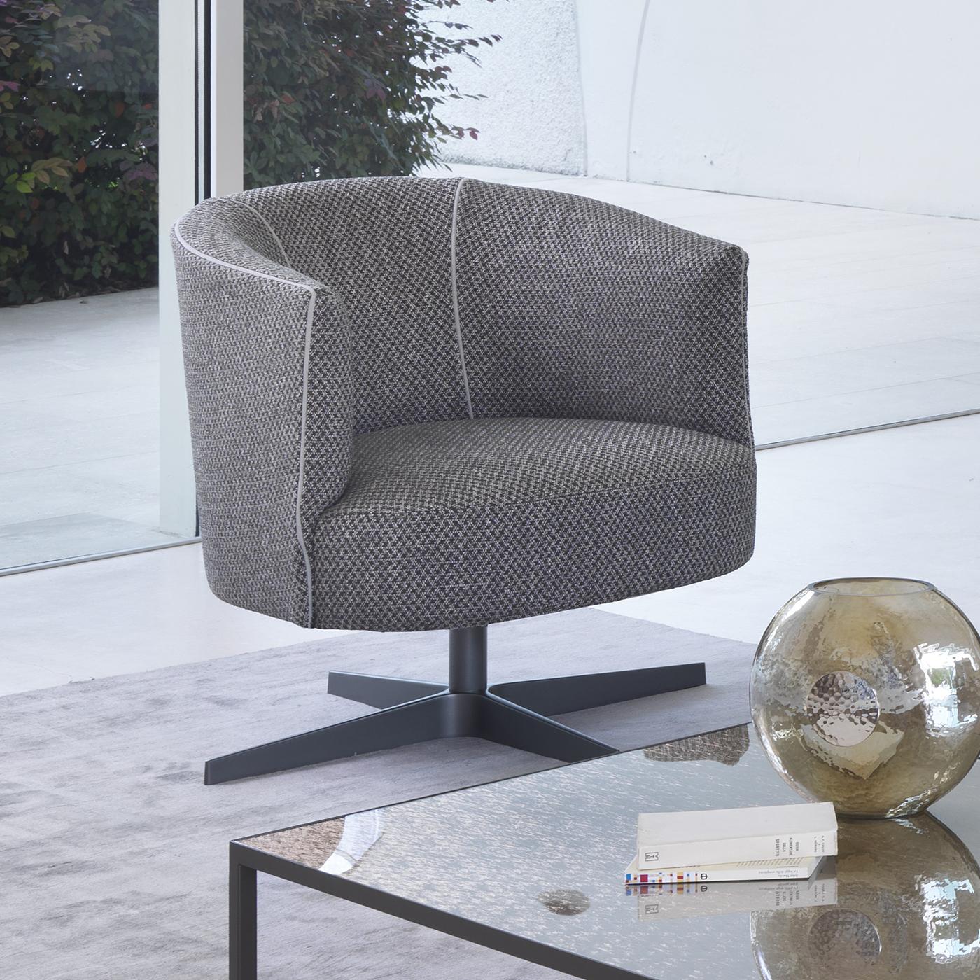It will be hard not to want to take a spin in this sophisticated swivel armchair. This chair has a plush seat cushion in memory foam and a backrest structure that are upholstered in a non-removable grey mélange fabric for a contemporary feel. The