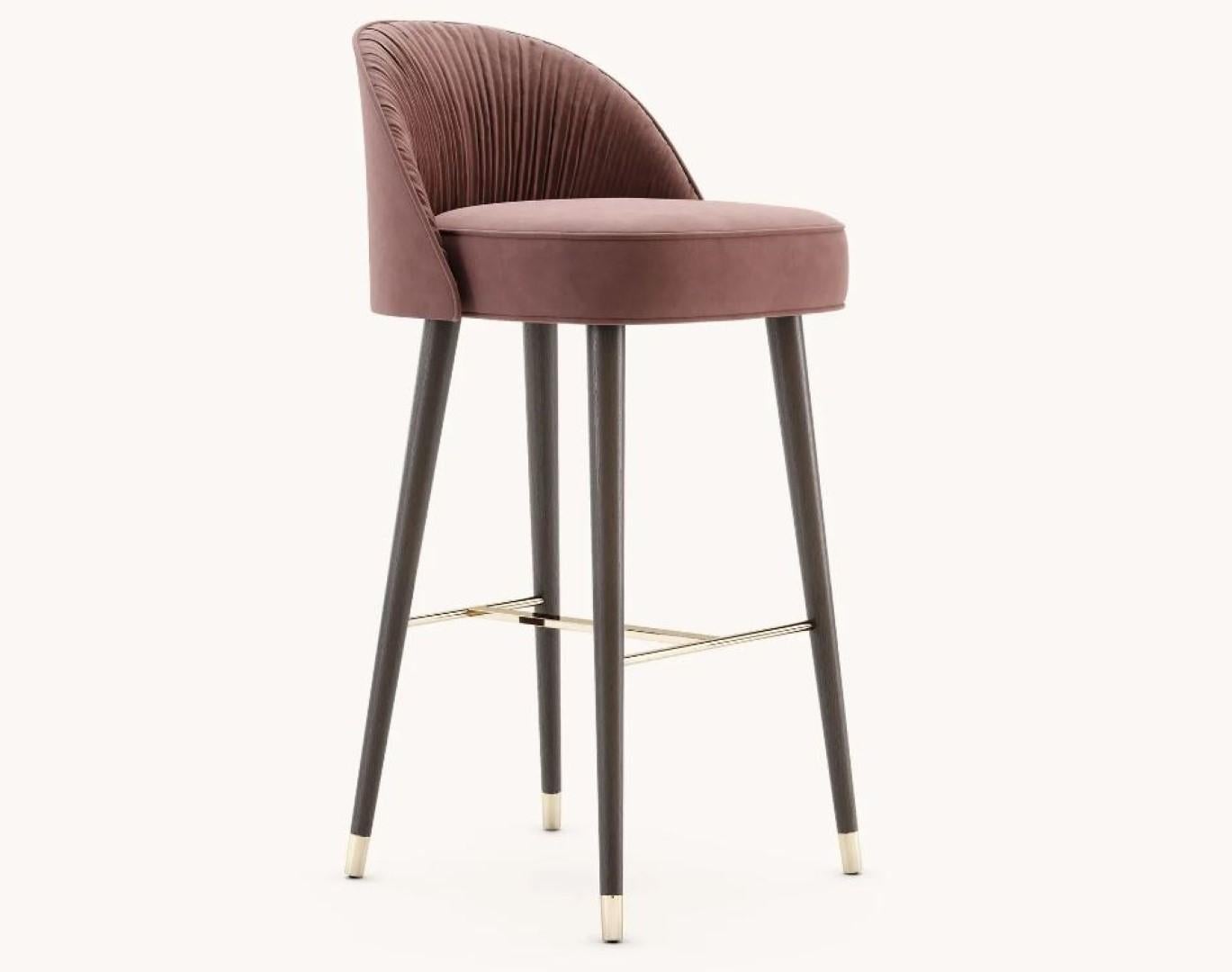 Camille bar chair with metal cups by Domkapa
Materials: Microfibers, Fumé stained beech, gold polished stainless steel.
Dimensions: W 53 x D 52 x H 101 cm. 
Also available in different materials.

Designed to make a statement, Camille bar and