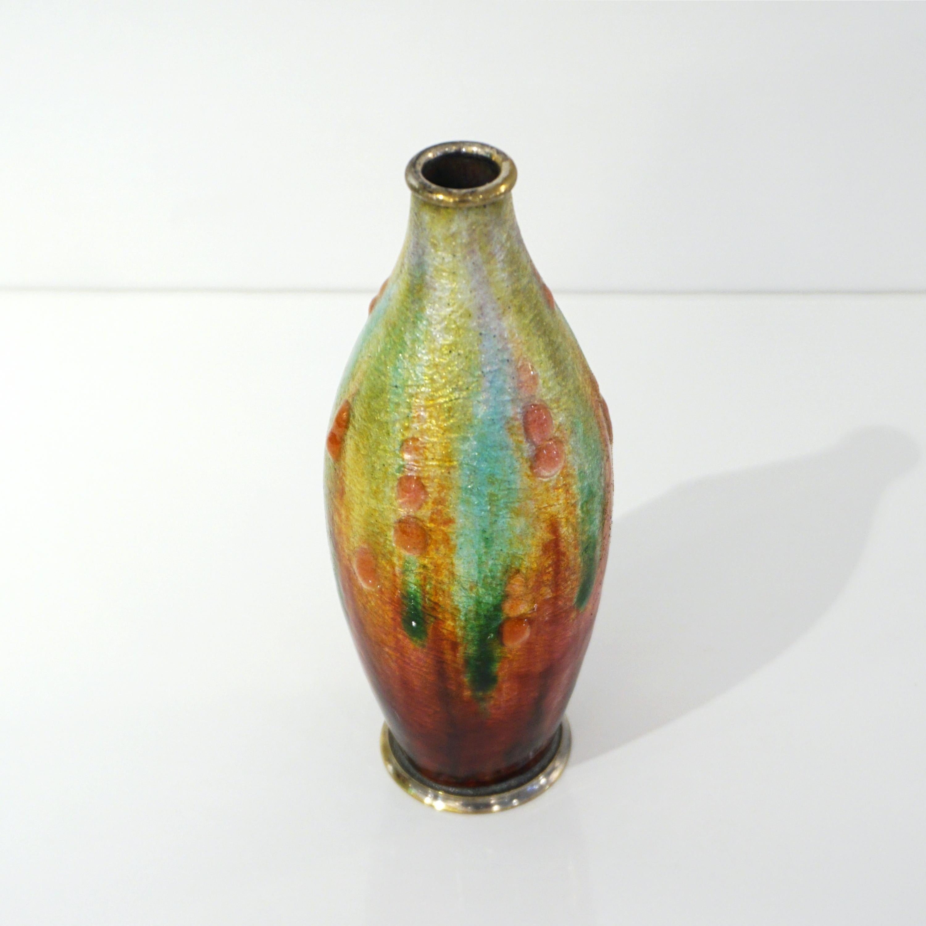 Early 20th century, Work of Art by the French artist Camille Fauré (1872-1952), this vase in copper is entirely covered in thick vibrant iridescent enamels in gold yellow, red, orange, and lime green tones, the drip decor creates an abstract