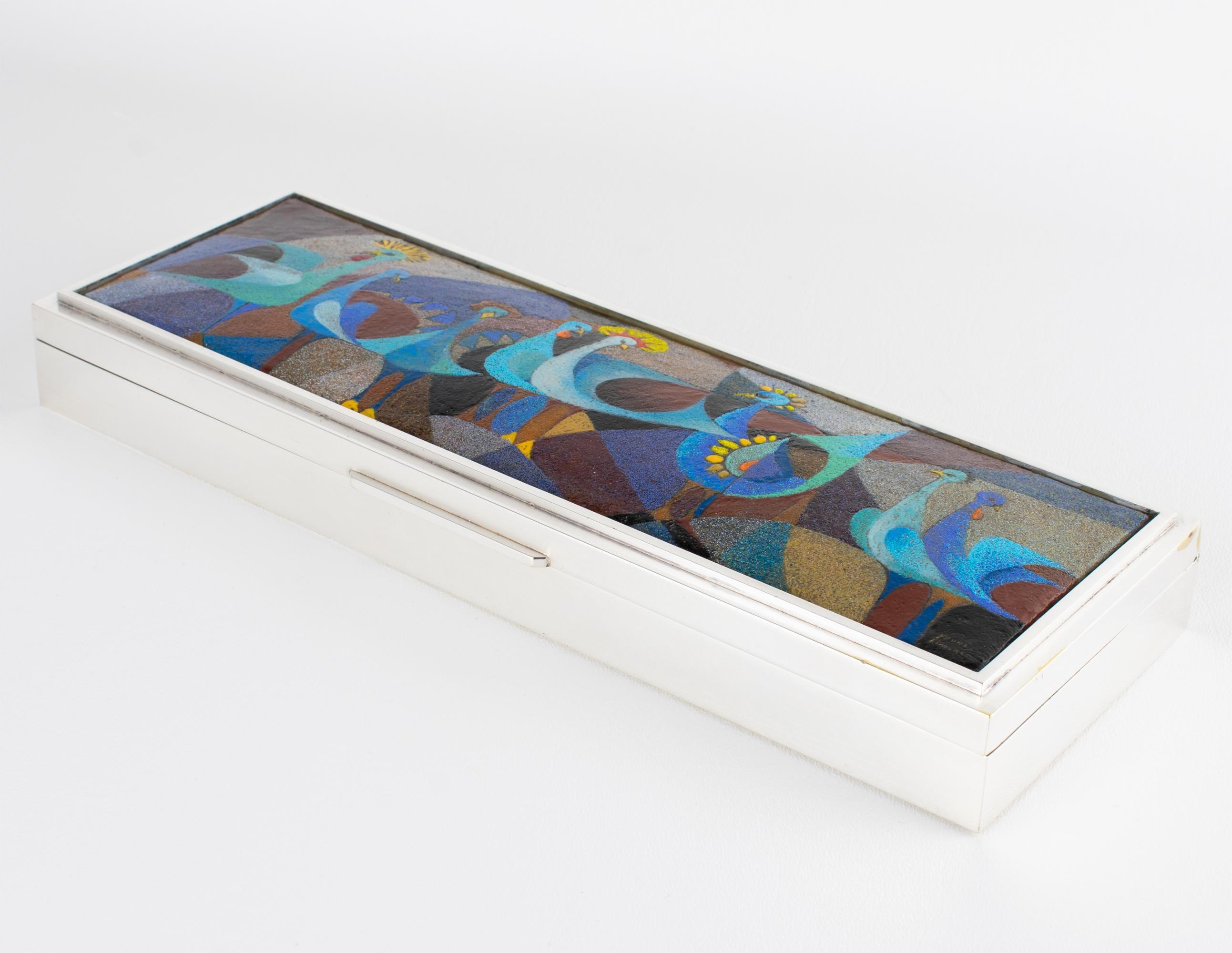 A rare and exquisite creation by Camille Fauré Limoges, this enamel and silver-plated decorative box is a masterwork of French craftsmanship, dating circa 1950. Likely a bespoke commission, the piece was produced in collaboration with renowned