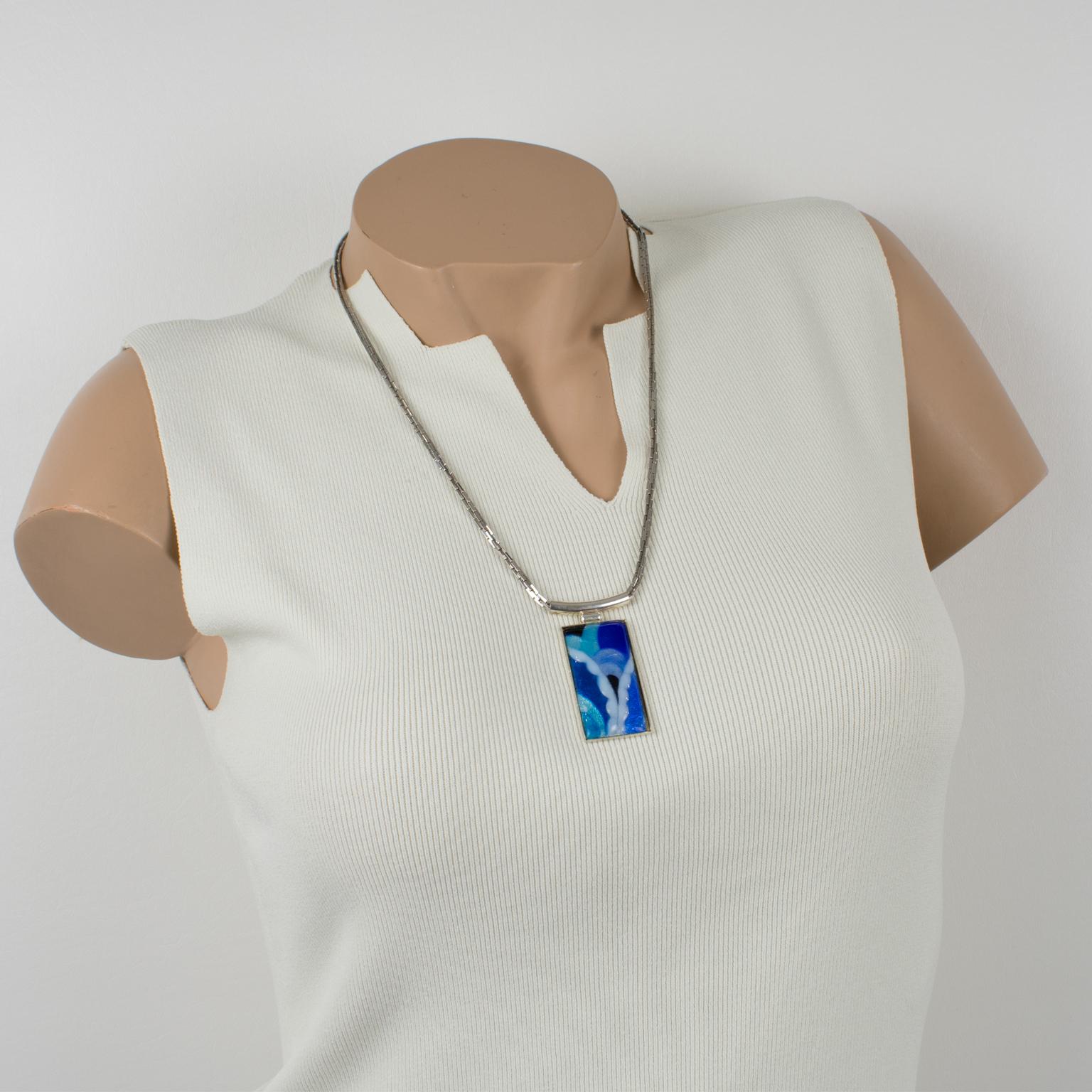 Amazing pendant necklace by Limoges enamelist artist Mauricette Pinoteau. Rectangular silver plate frame with an enamel-on-copper cameo. Art-Deco inspired design with a geometric shape. Assorted colors of cobalt blue and turquoise blue, navy blue,