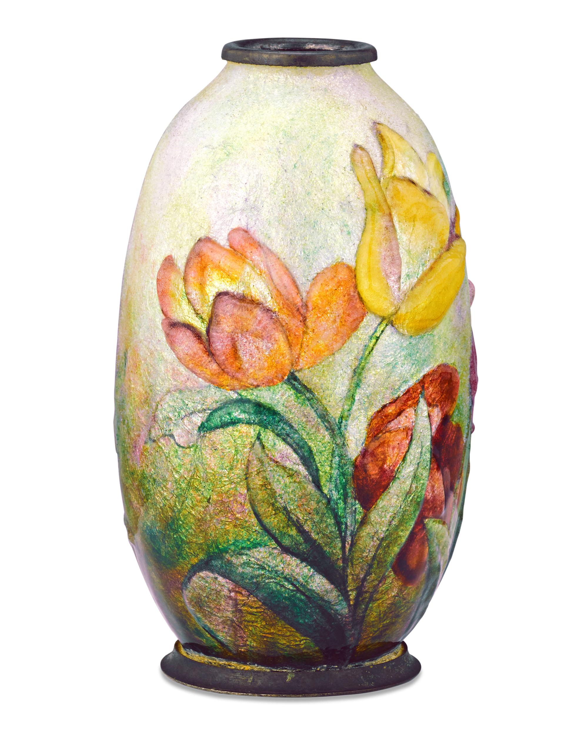 Featuring one of the artist's favorite motifs — intricate and colorful floral designs — this enameled vase by Camille Fauré embodies the artist's highly unique style. Fauré employs his signature raised enameling in this vase, which is achieved by