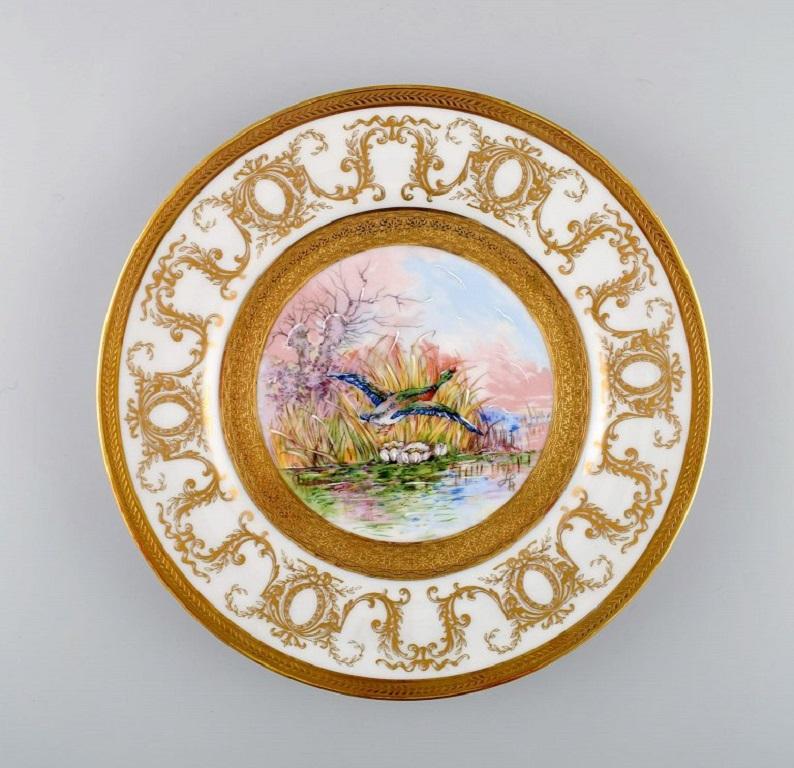 Hand-Painted Camille Tharand for Limoges, Four Decorative Plates in Porcelain, 1930s For Sale