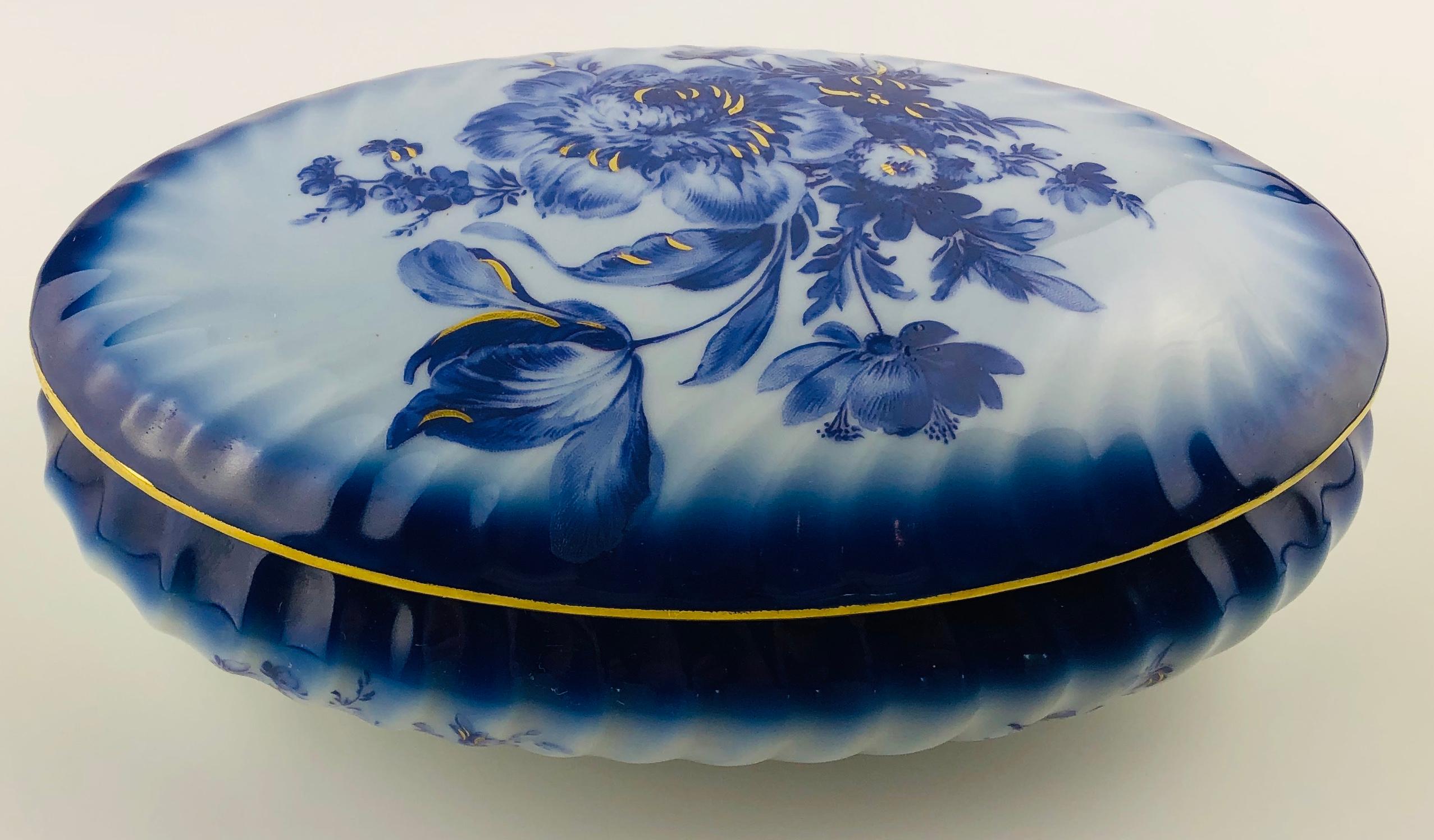 Beautiful blue and white Limoges handcrafted and hand painted gold trimmed trinket, jewelry box or candy dish, circa 1930. 
Signed Tharaud, Limoges.

This Limoges trinket box or candy dish signed Camille Tharaud, France is very good quality
