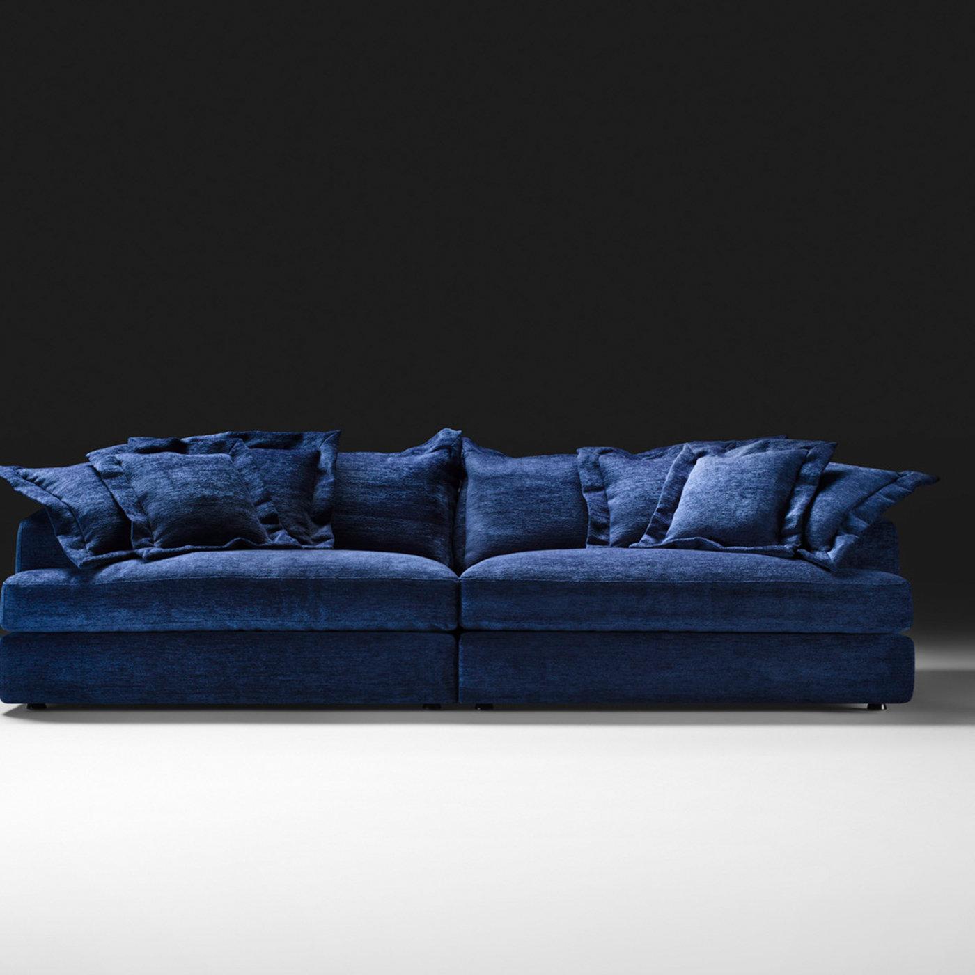 This sofa has a captivating allure that exudes extreme and unique comfort. The structure combines fine materials such as poplar and fir, and is equipped with an elastic belt spring system and padded with multi-density and highly-resistant