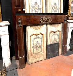 Walnut Empire frame fireplace, panelled with side half-columns, italy