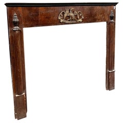 Walnut Empire frame fireplace, panelled with side half-columns, italy
