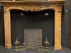 Richly carved yellow Siena marble fireplace, italy