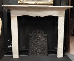 Light gray marble fireplace, contoured top and front, Italy