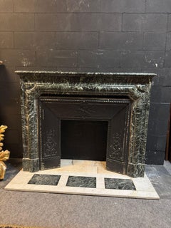 Green Alps marble mantle fireplace, carved with original threshold, italy
