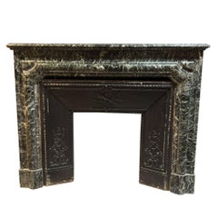 Green Alps marble mantle fireplace, carved with original threshold, italy