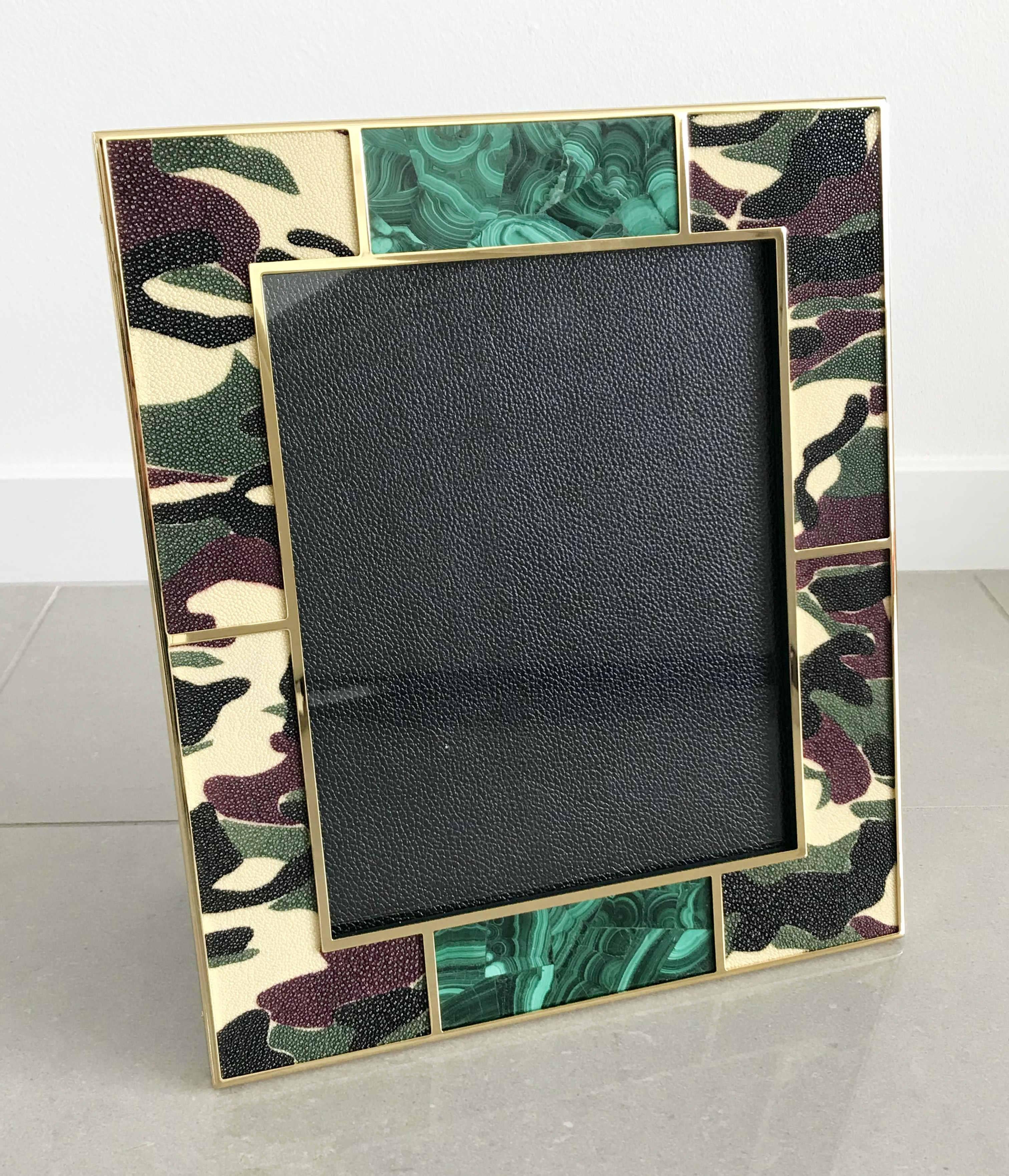 Camouflage colored shagreen leather with malachite inserts and 24-karat gold-plated picture frame by Fabio Ltd
Measures: Height 13.5 inches, width 11.5 inches, depth 1 inch
Photo size: 8 inches by 10 inches
LAST one in stock in Palm Springs ON 20%