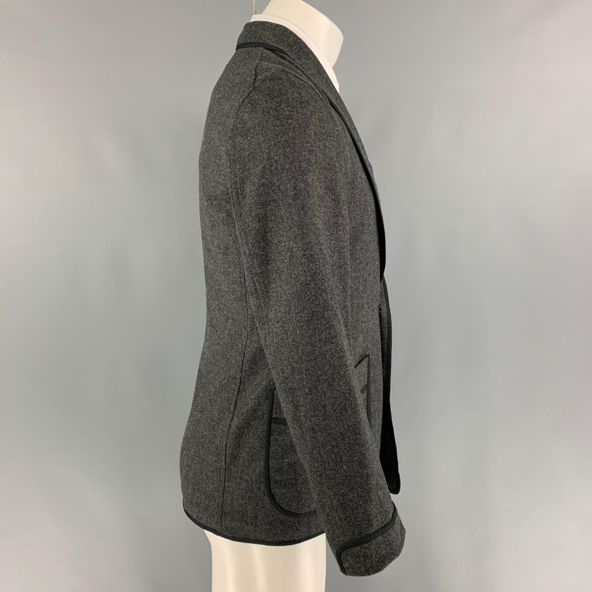 CAMOSHITA by UNITED ARROWS sport coat comes in a grey heather material featuring a shawl collar, patch pockets, and a double breasted closure. Made in Japan. 

Very Good Pre-Owned Condition.
Marked: 44
Original Retail Price: