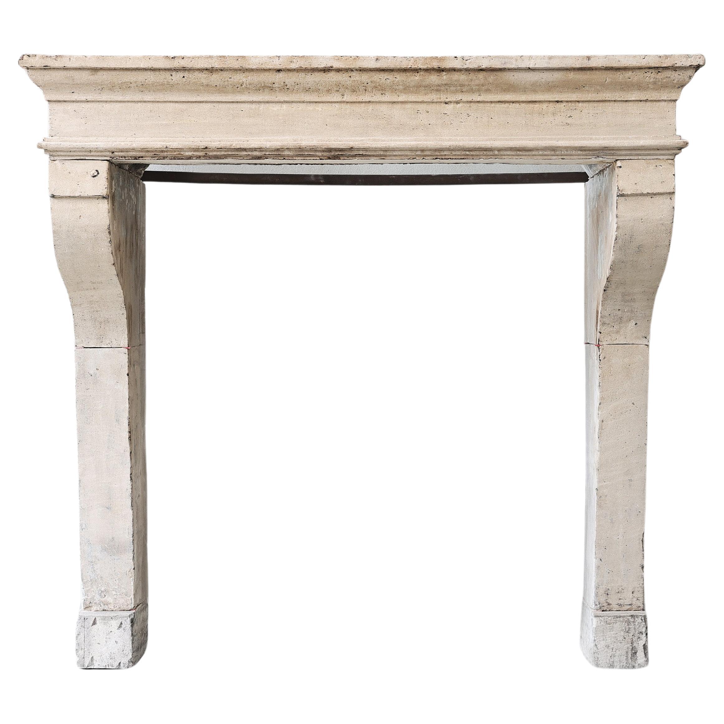Antique fireplace of French limestone For Sale