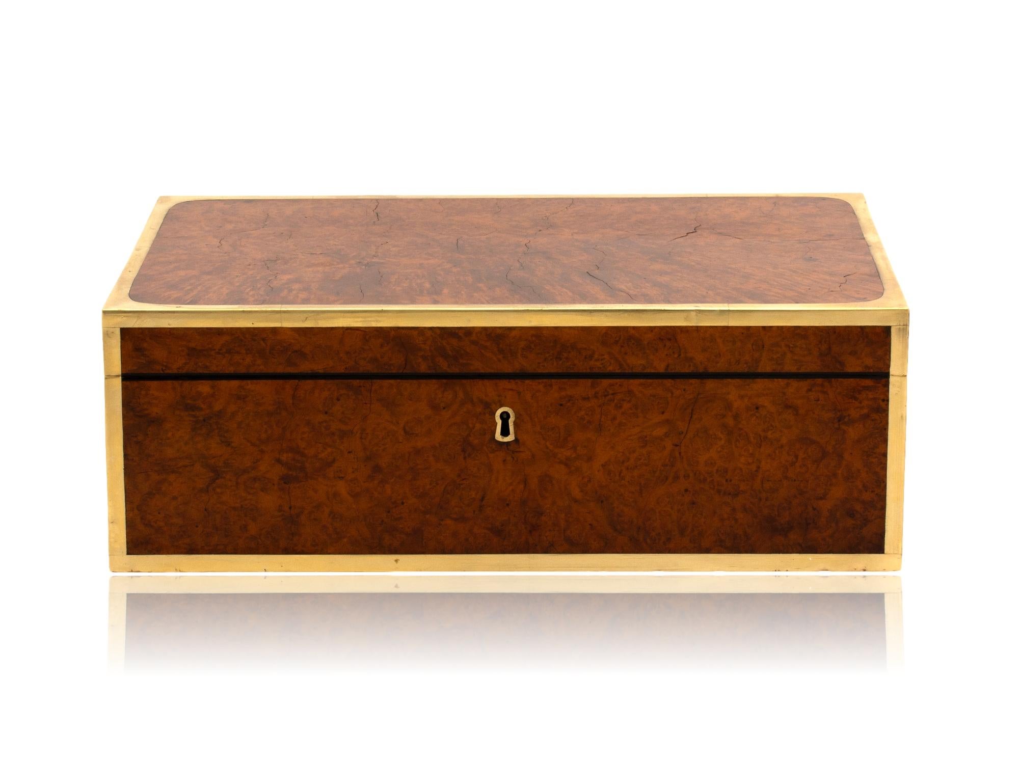 Exotic Amboyna

From our Jewellery Box collection, we are delighted to introduce this large Anglo-Indian Campaign Amboyna Box. The Amboyna Box of large rectangular form veneered in beautiful Amboyna with golden burr grain framed in thick squared