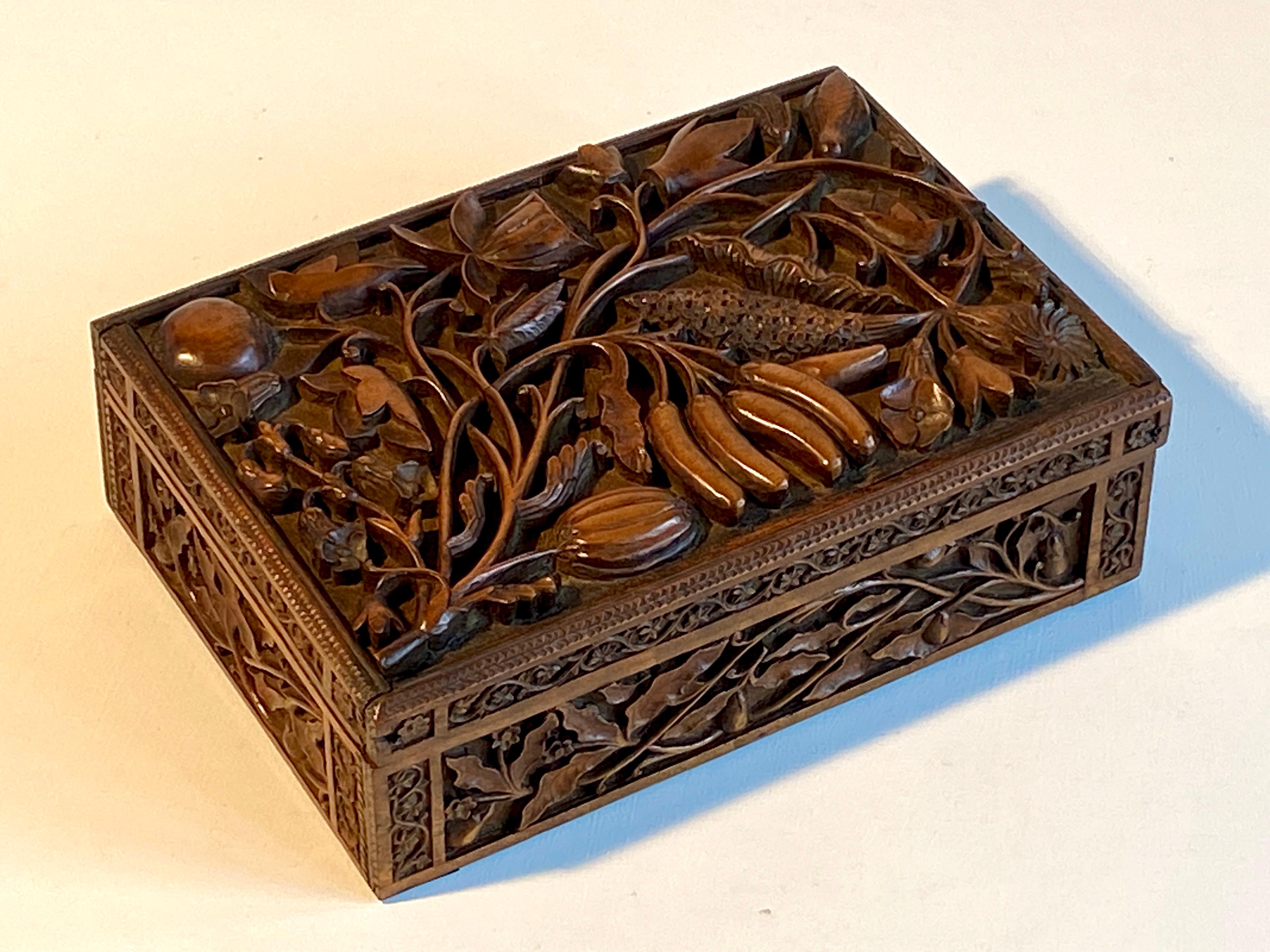 Campaign Box Carved Gentleman's British Army WW2 Regimental Arms

Beautifully stylized and masterfully carved wooden box of floral and fruit foliage bas-relief on the outside and British Army WW2 regimental arms motif crests and plaque on the