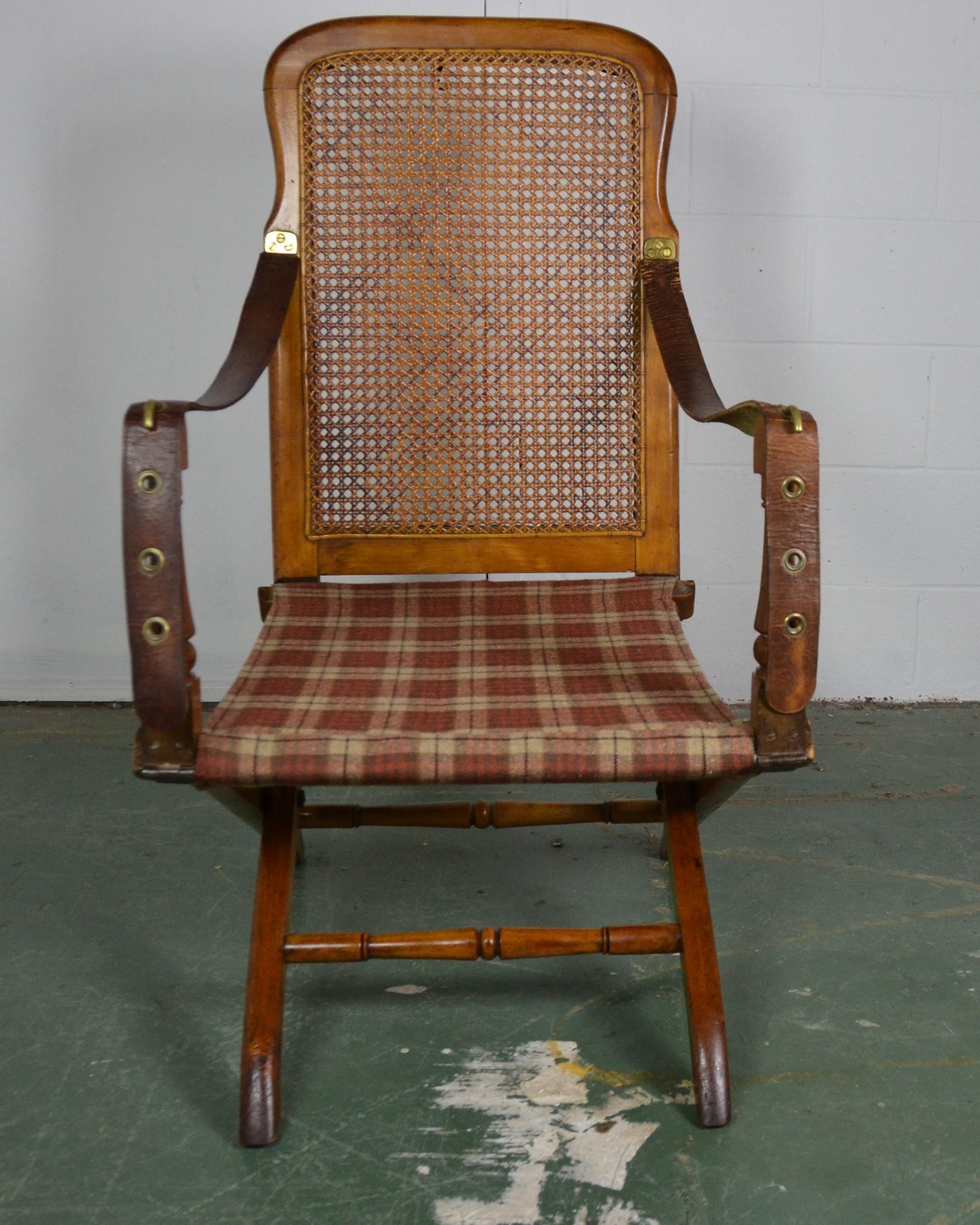 Douro ( Campaign ) Chair by J. T Thompson Patented.  1808 - 1841  The arms are leather the back is cane and the seat is fabric. Brass label reads: 