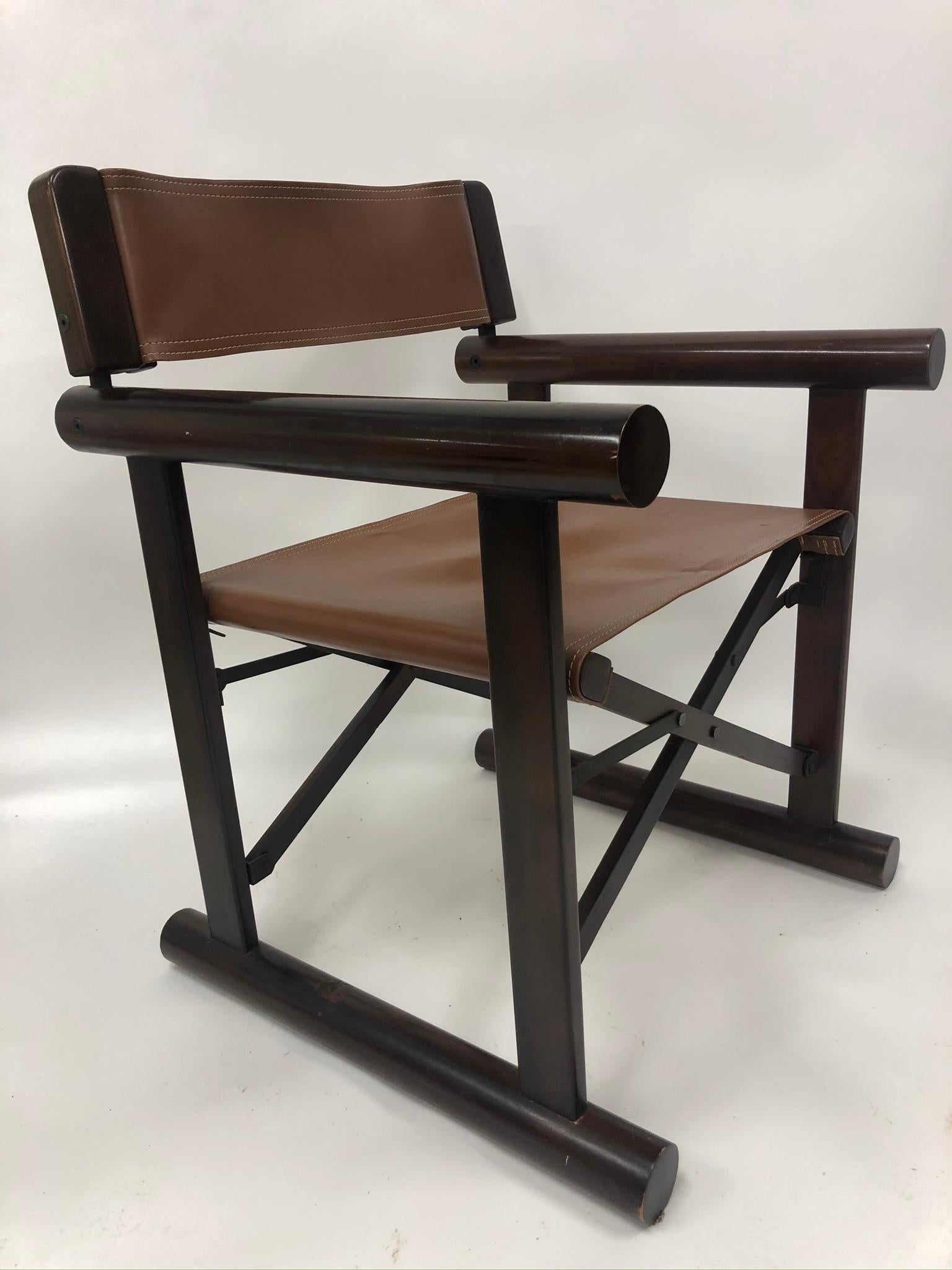 Campaign chair with faux leather seat back. Dimensions: W 24