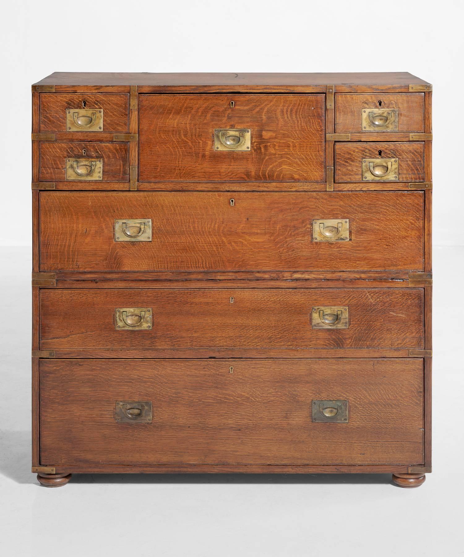 Campaign chest of drawers, circa 1910

Unique oak chest with original brass mounts and hardware.