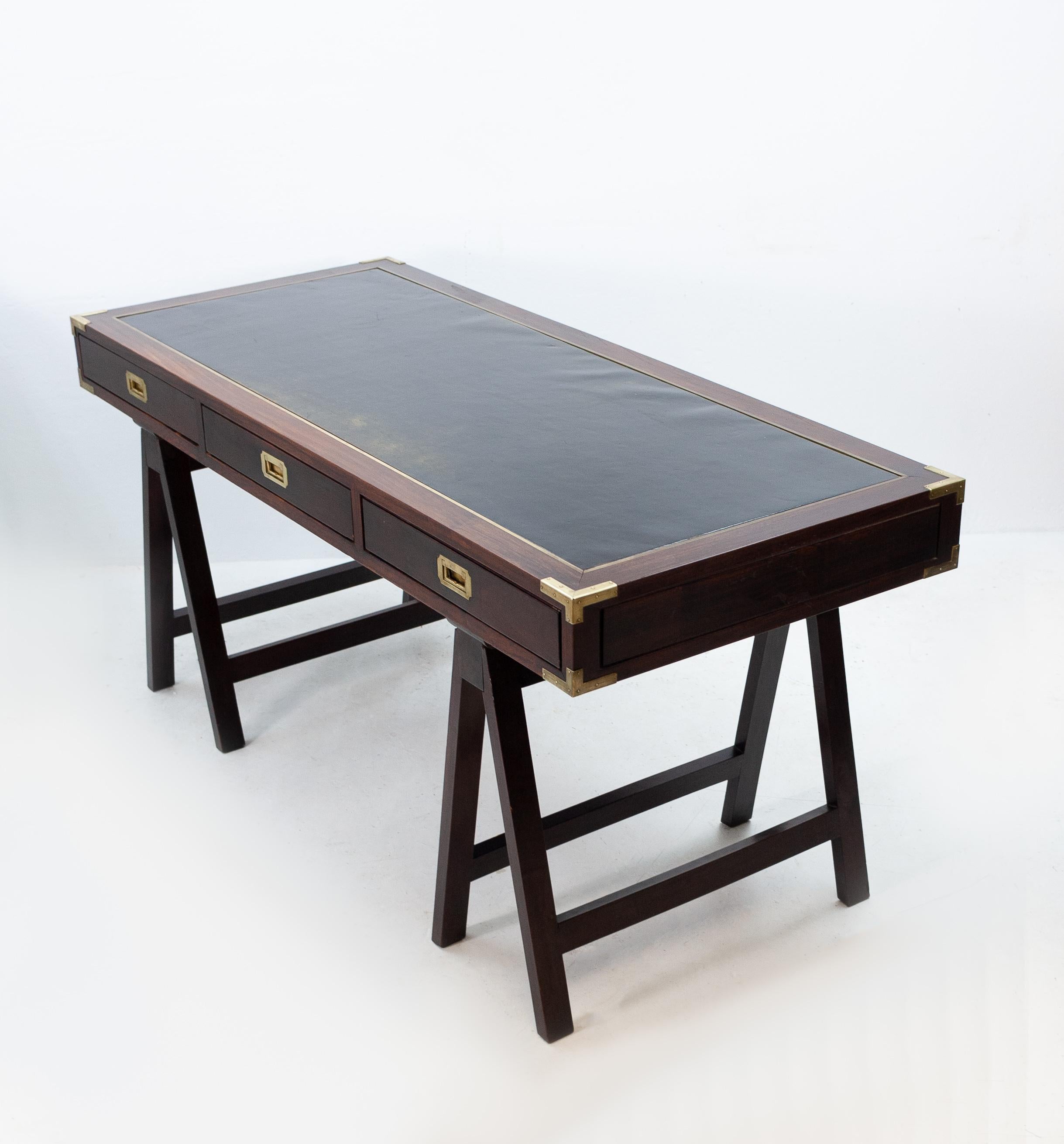 Campaign desks were used by military officers and their staffs during military campaigns and were, typically, the private property of the officer. This desk looks like a design by Charlotte Horstmann Hong Kong antiques dealer and furniture maker.