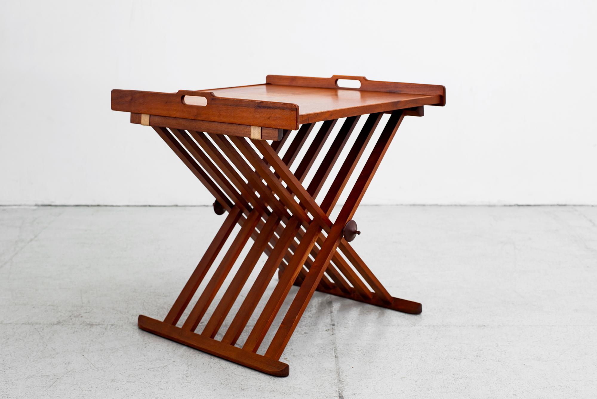 Campaign folding table with removable traysand folding scissor bases. Mod. no. 881-401, from the Declaration Line by Stewart MacDougall and Kipp Stewart for Drexel Furniture Company, American, circa 1960.