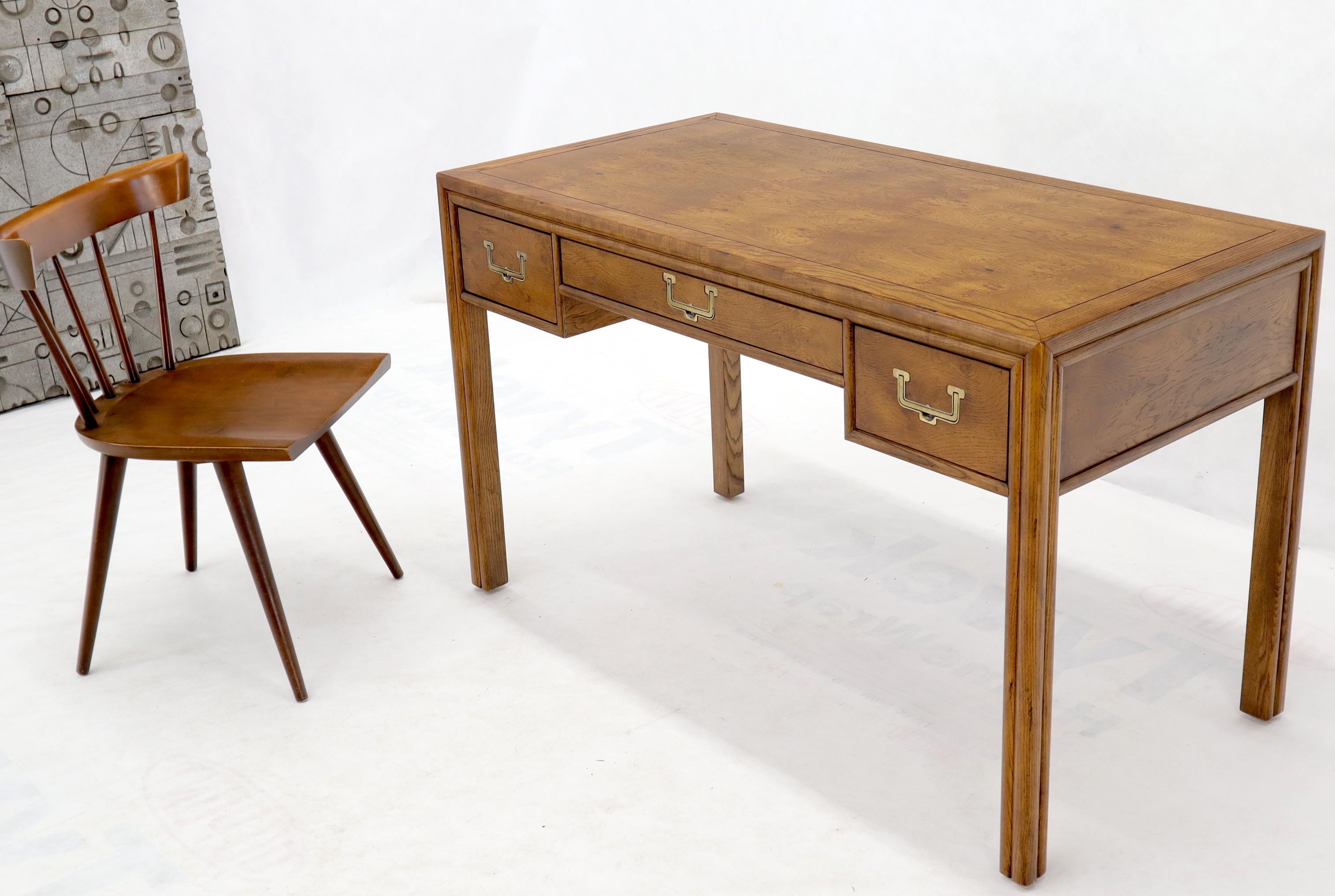 Brass hardware Campaign style Mid-Century Modern desk writing table by Henredon. Stunning fruitwood grain pattern along with outstanding craftsmanship.