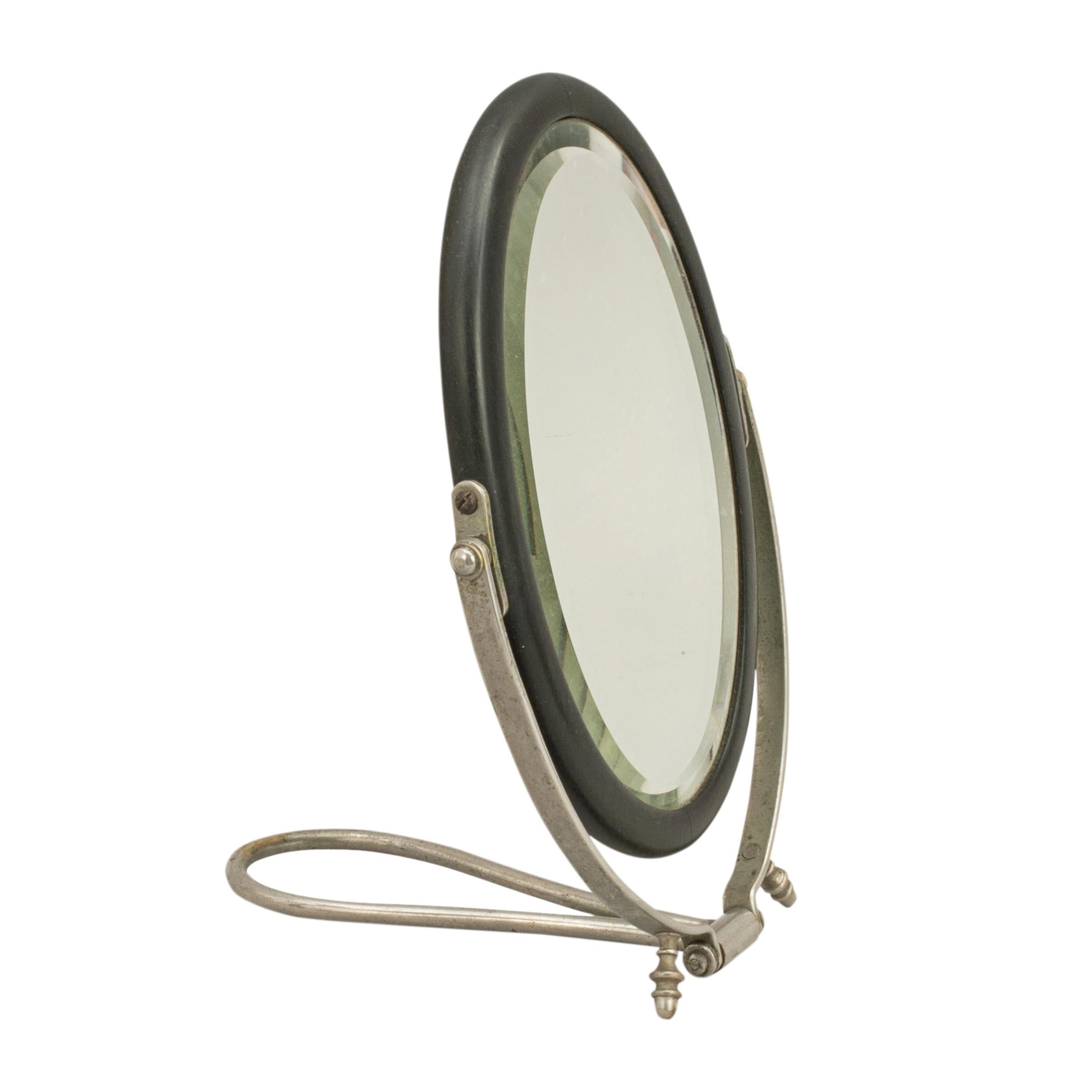 Vintage travellers mirror.
A compact campaign mirror in original travelling leather case. The mirror folds up for easy storage and has a plated metal frame with an ebony cased mirror. The folding travellers mirror is ideal for taking on weekend