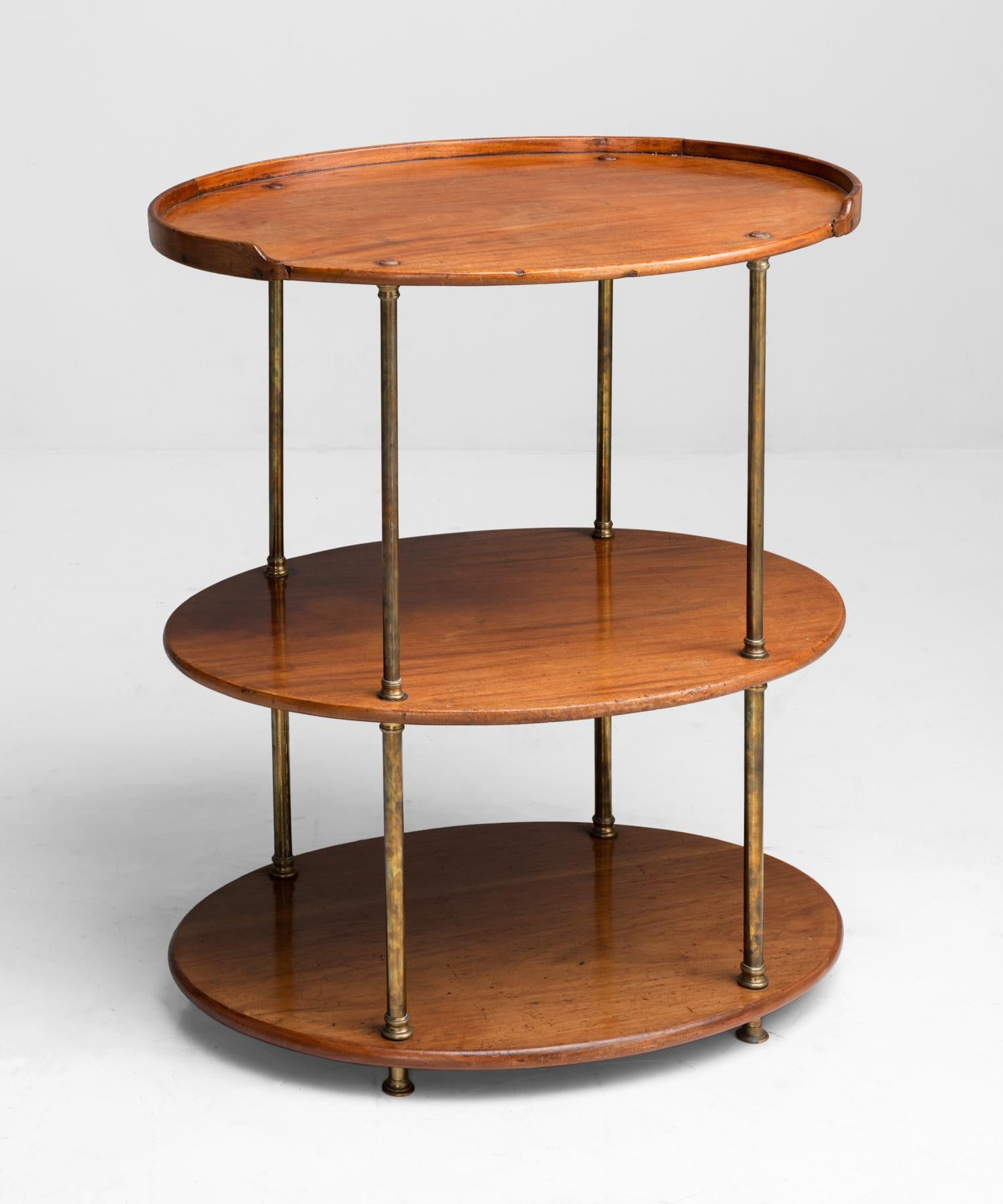 Campaign Shelving Unit, England, circa 1900

Oval shaped shelves in mahogany with brass column supports.