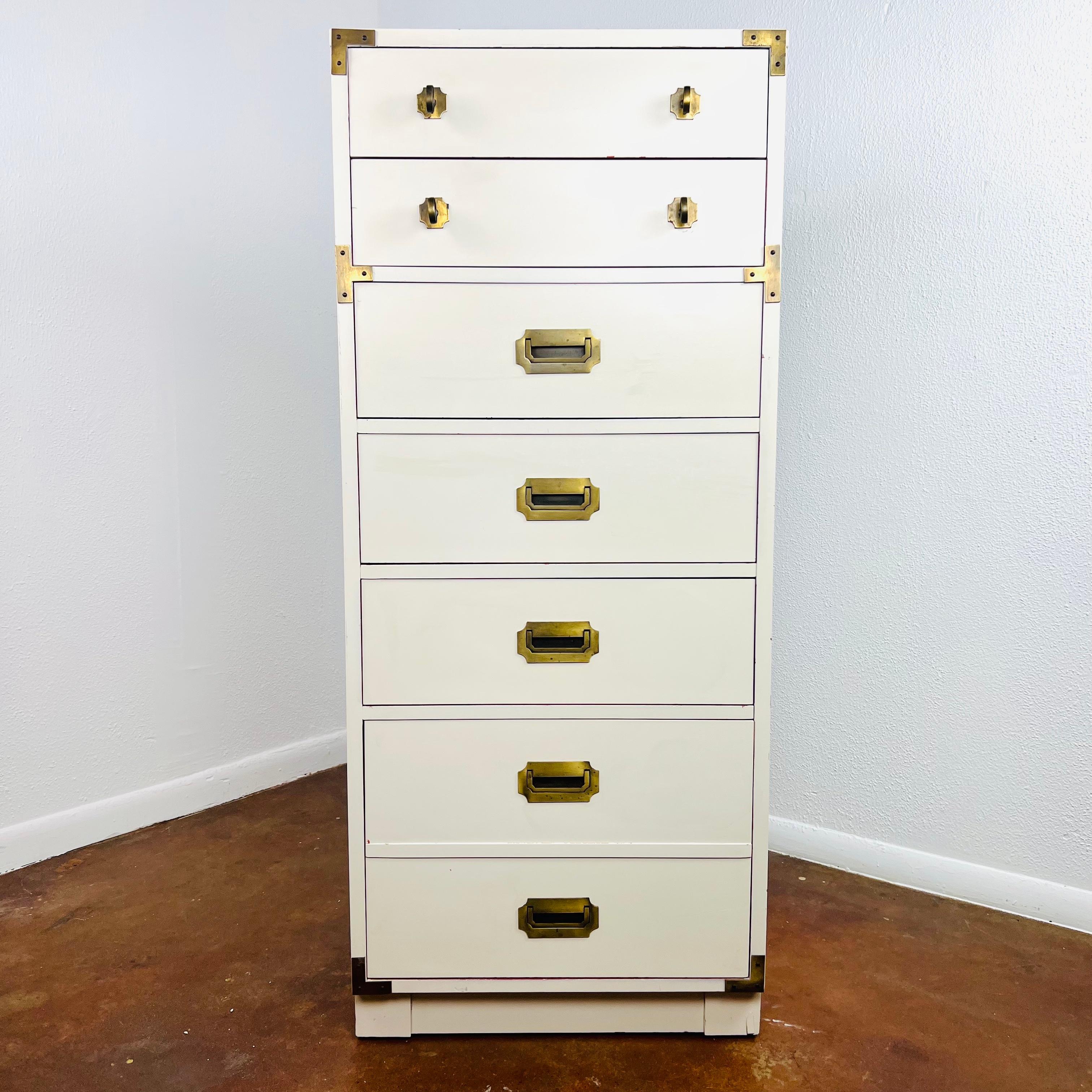 Fabulous and rare vintage campaign tall dresser/lingerie chest. Expertly crafted solid wood construction. 
Original brass accents and classic campaign hardware.
Space saving with 6 spacious storage drawers and ample storage.
Very fabulous and