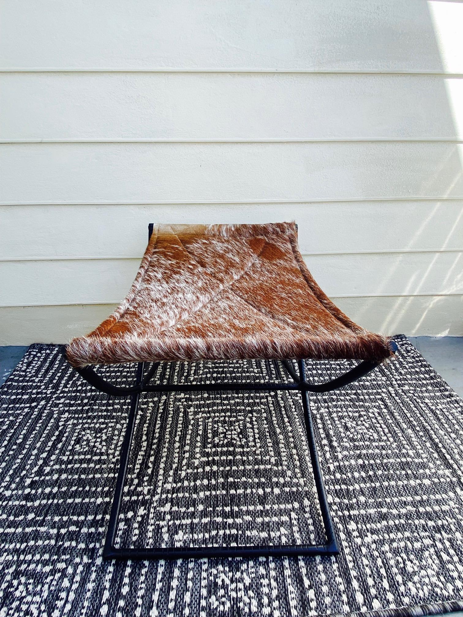 Campaign Style Bench with Brown and White Leather Hide Seat and Iron Base In Good Condition In Fort Lauderdale, FL